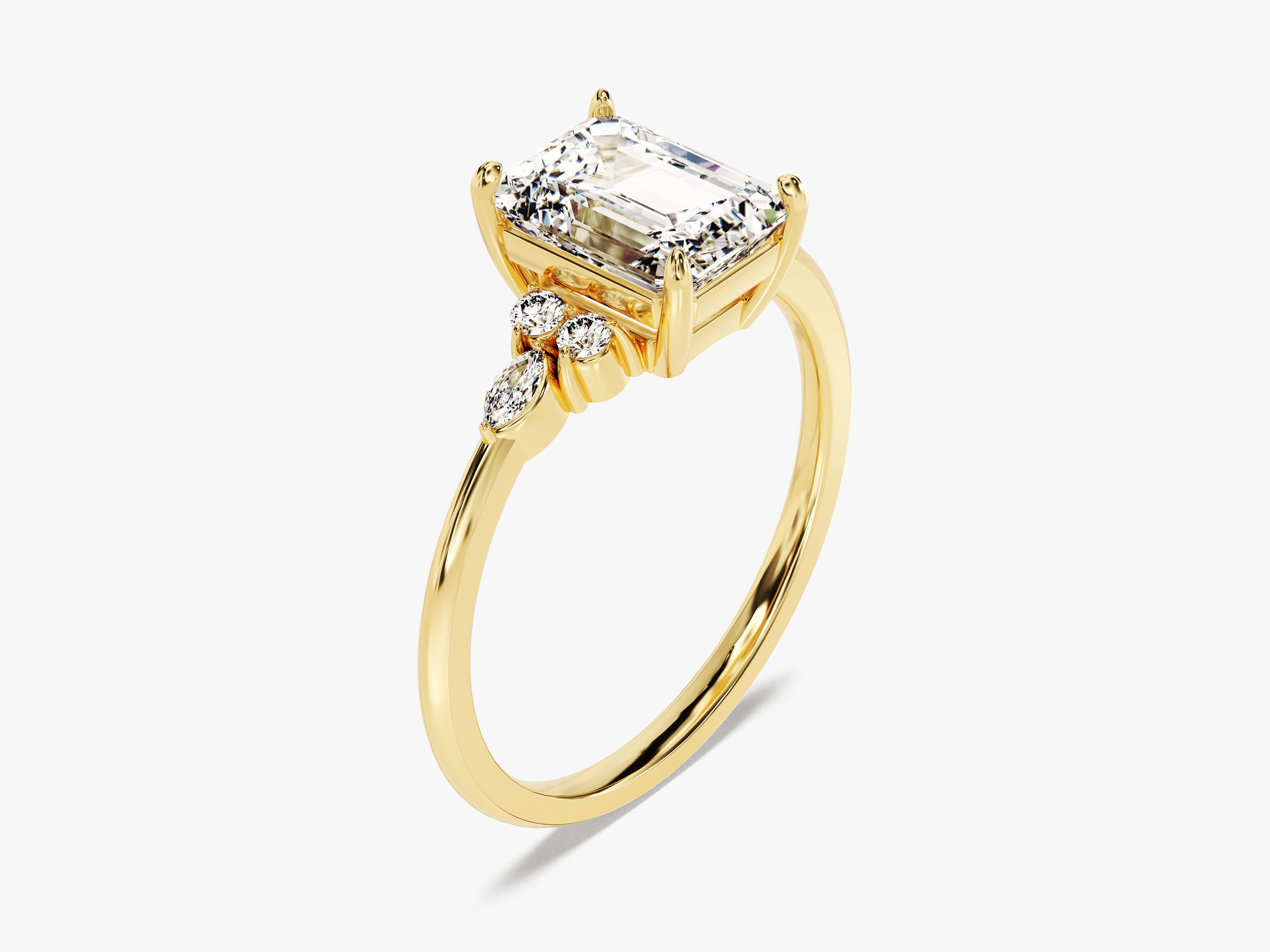 Emerald cut diamond ring in yellow gold with accent stones