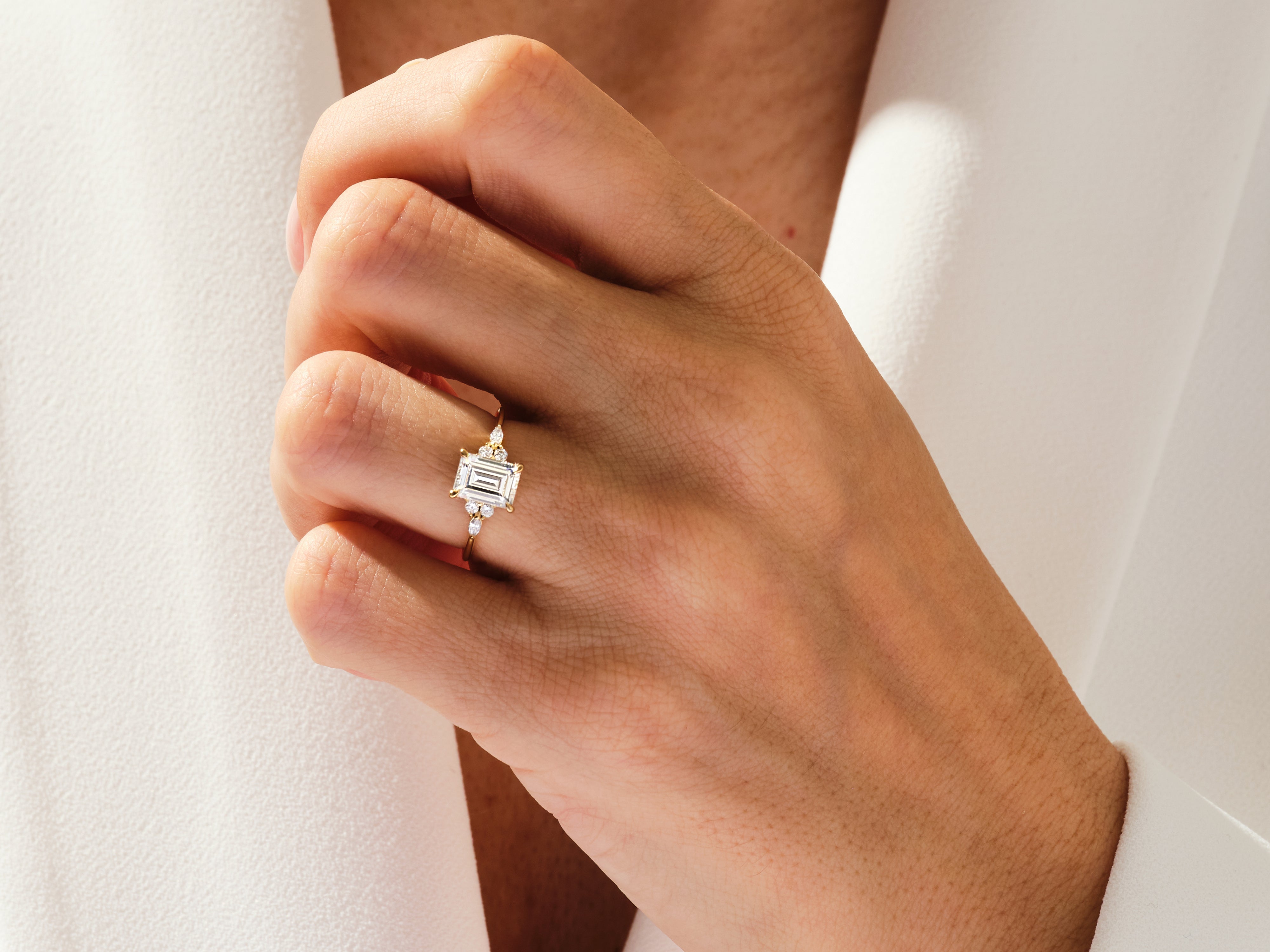 Emerald cut diamond ring on hand, fine jewelry for women