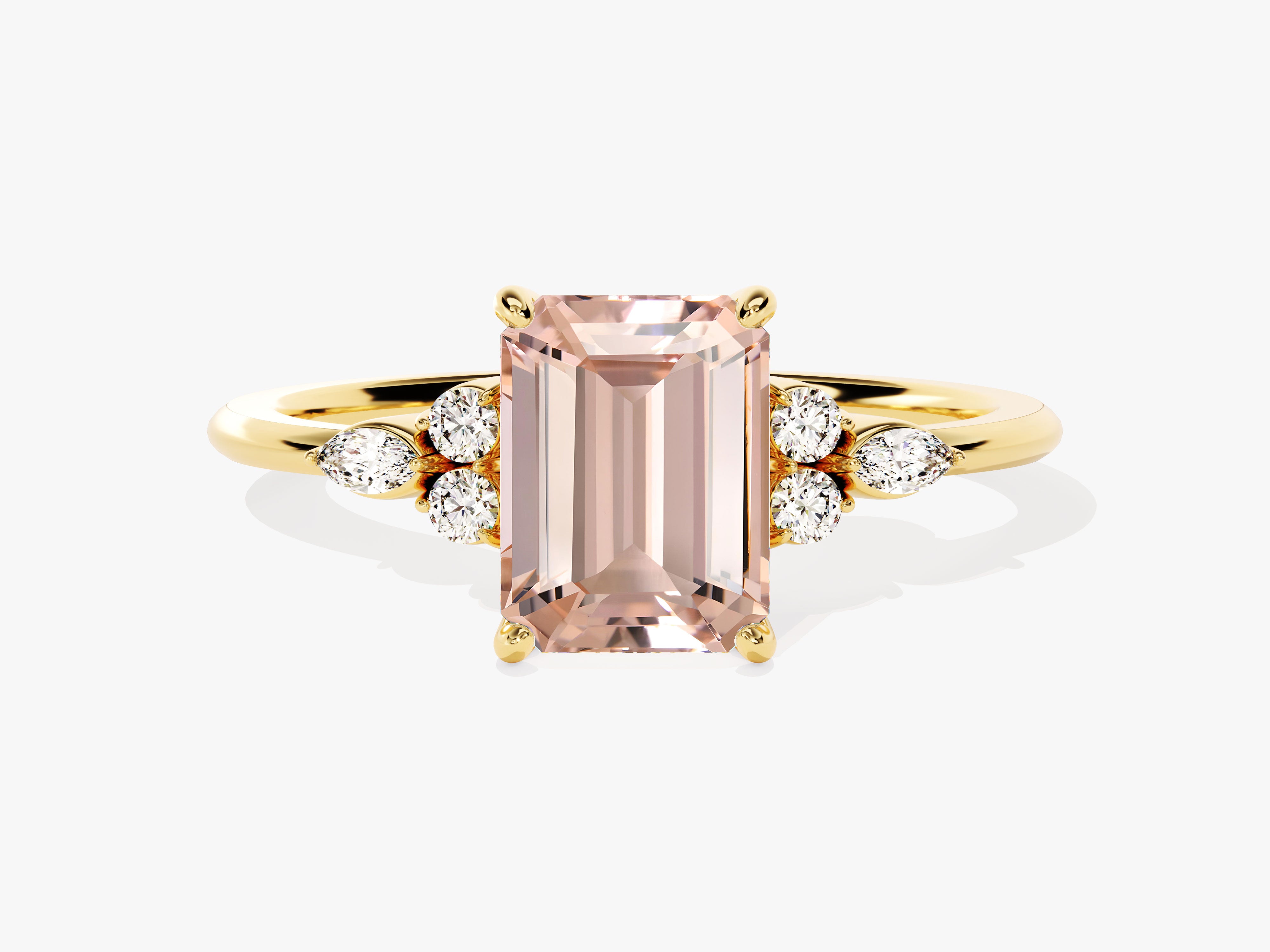 Emerald cut morganite ring with diamond accents on gold band