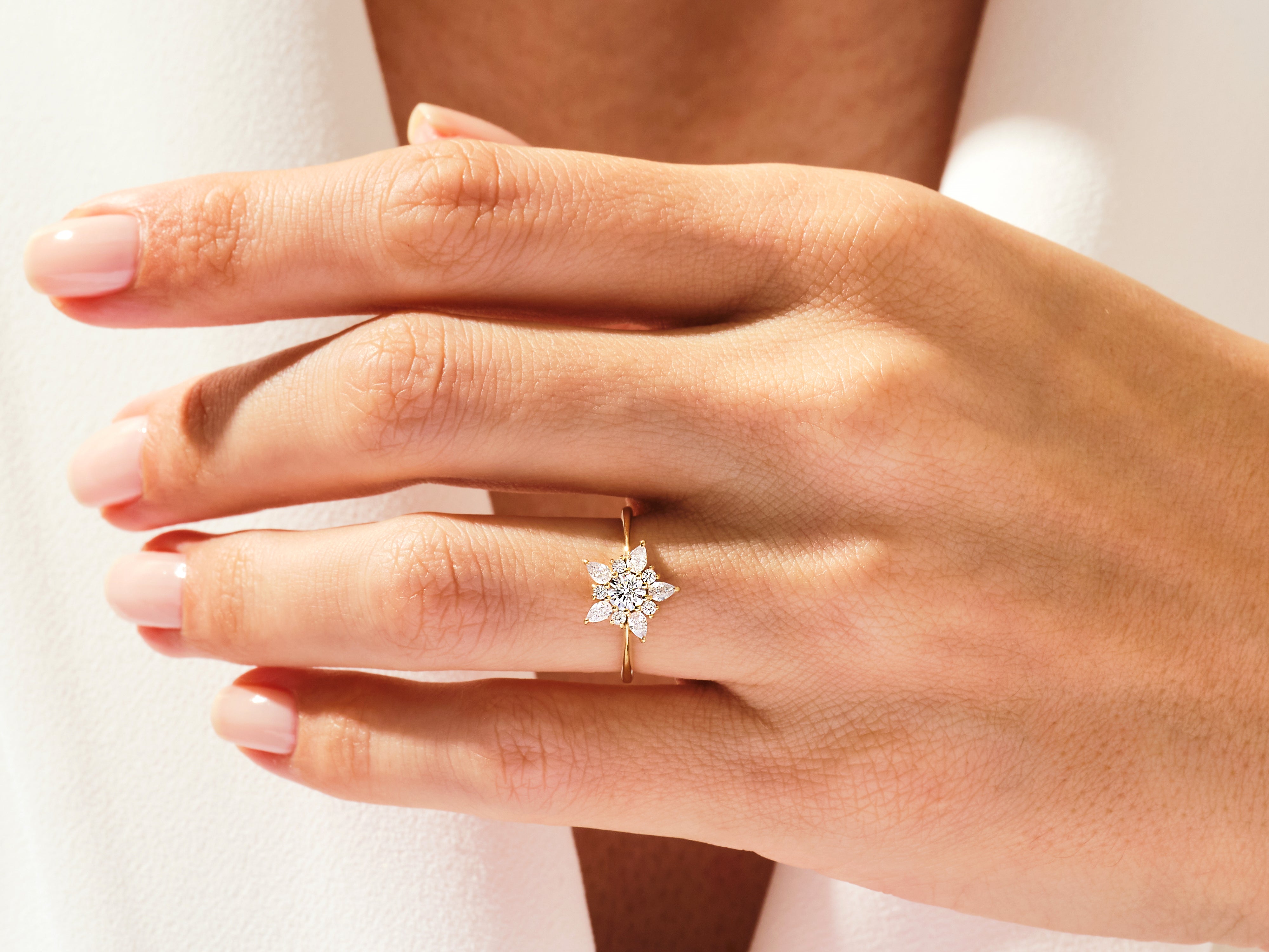Diamond flower ring on a woman's hand