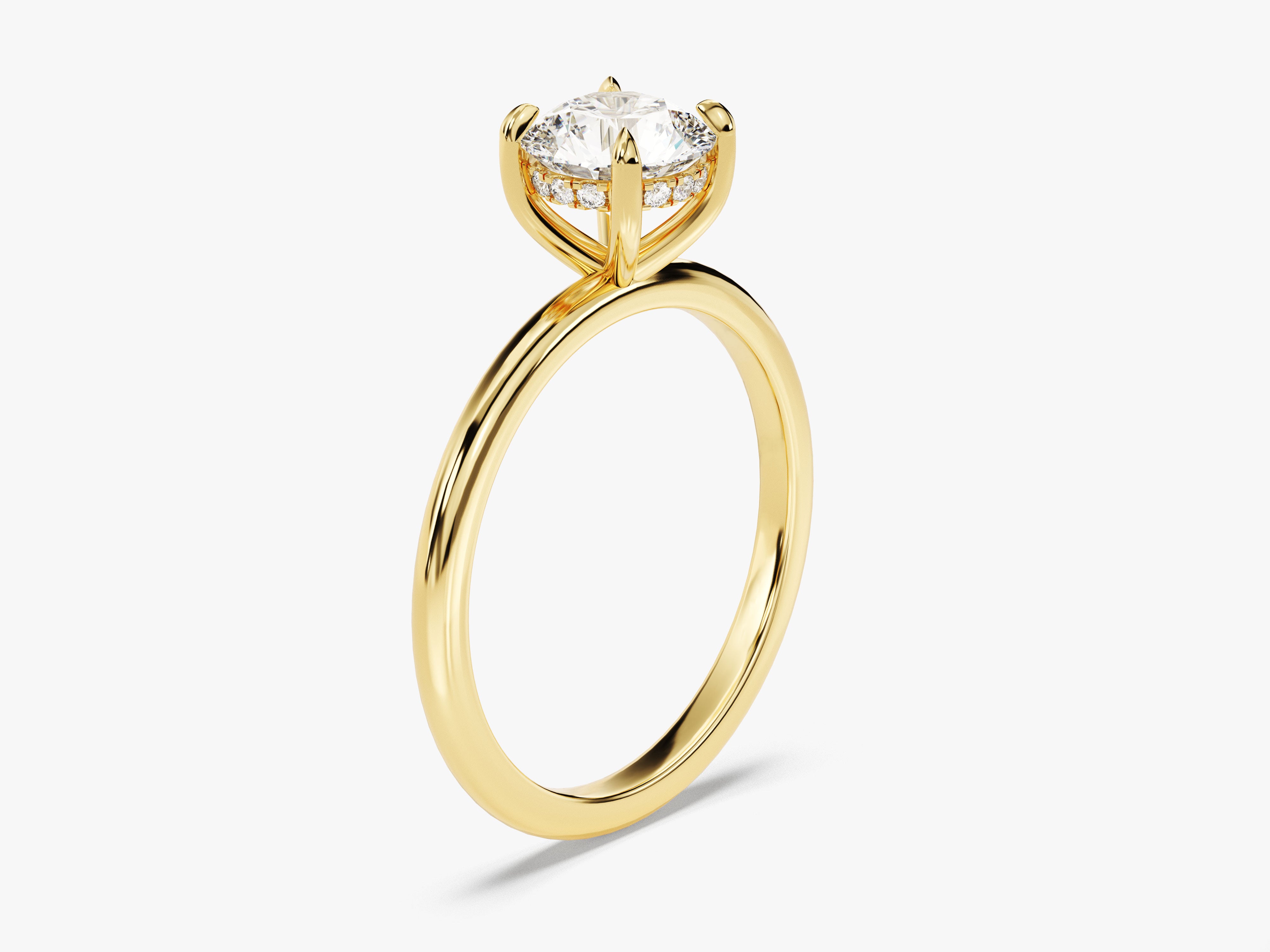 Gold diamond engagement ring with halo setting