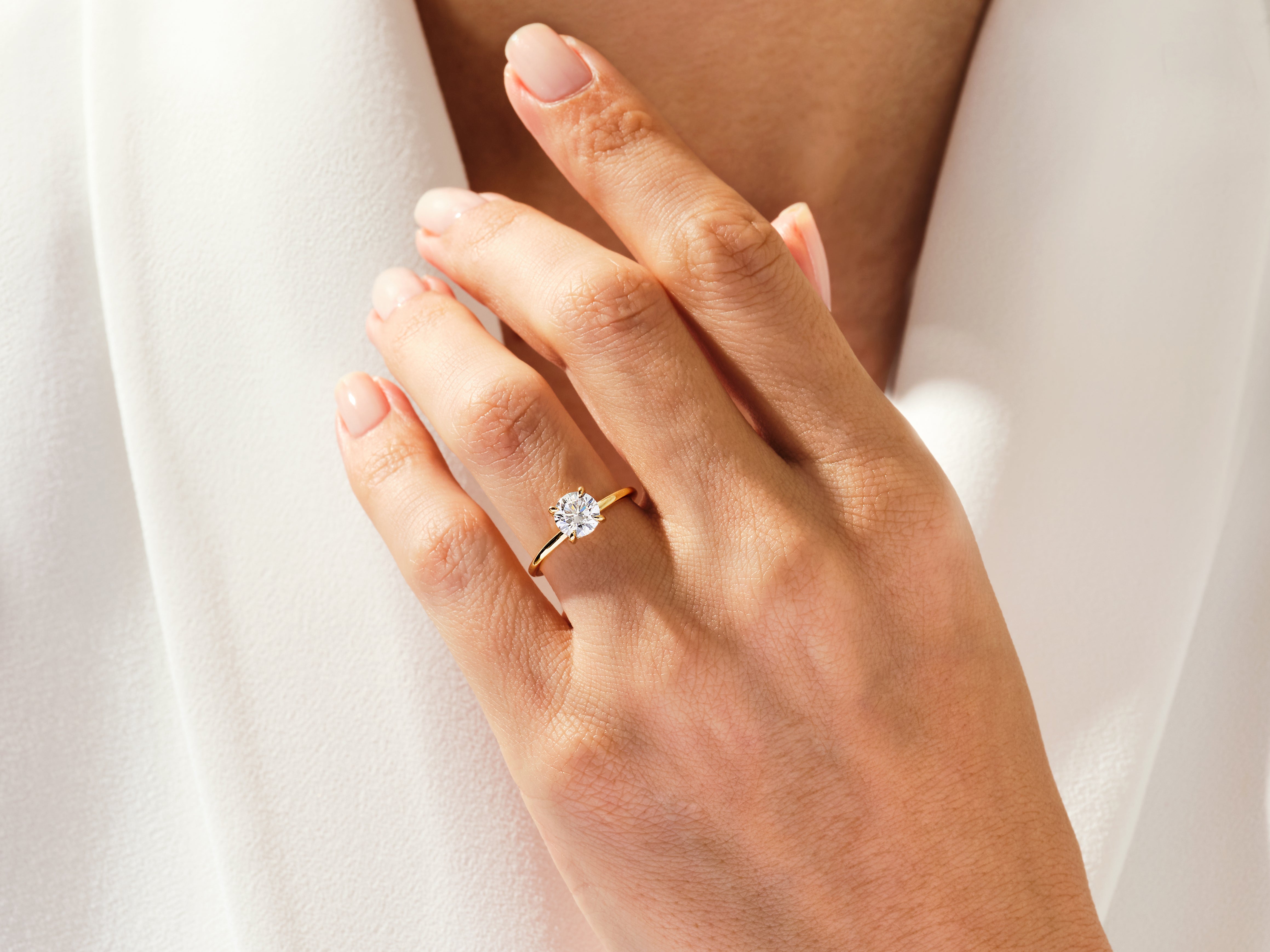 Diamond engagement ring on a woman's hand, fine jewelry