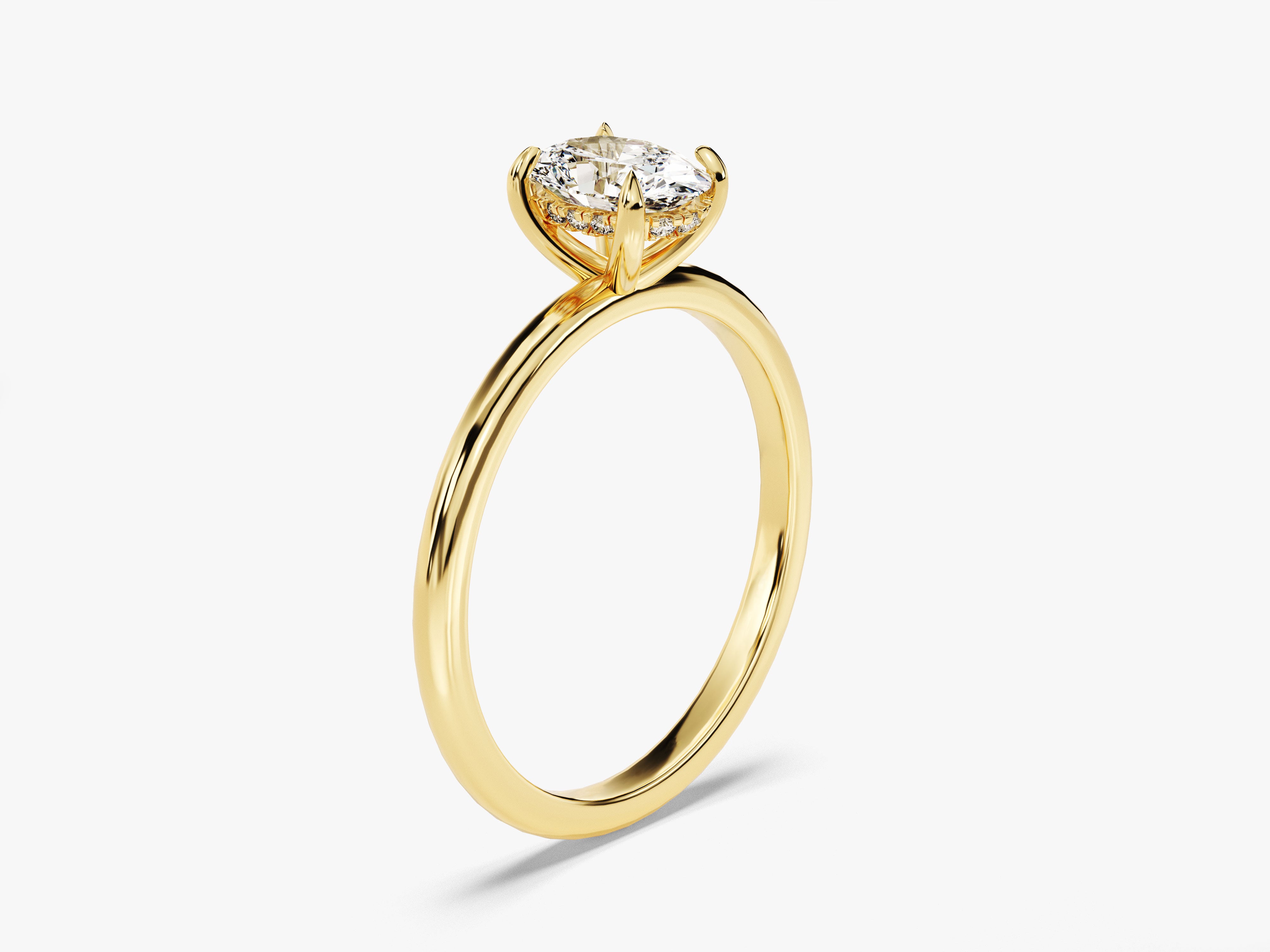 Gold diamond engagement ring with halo setting