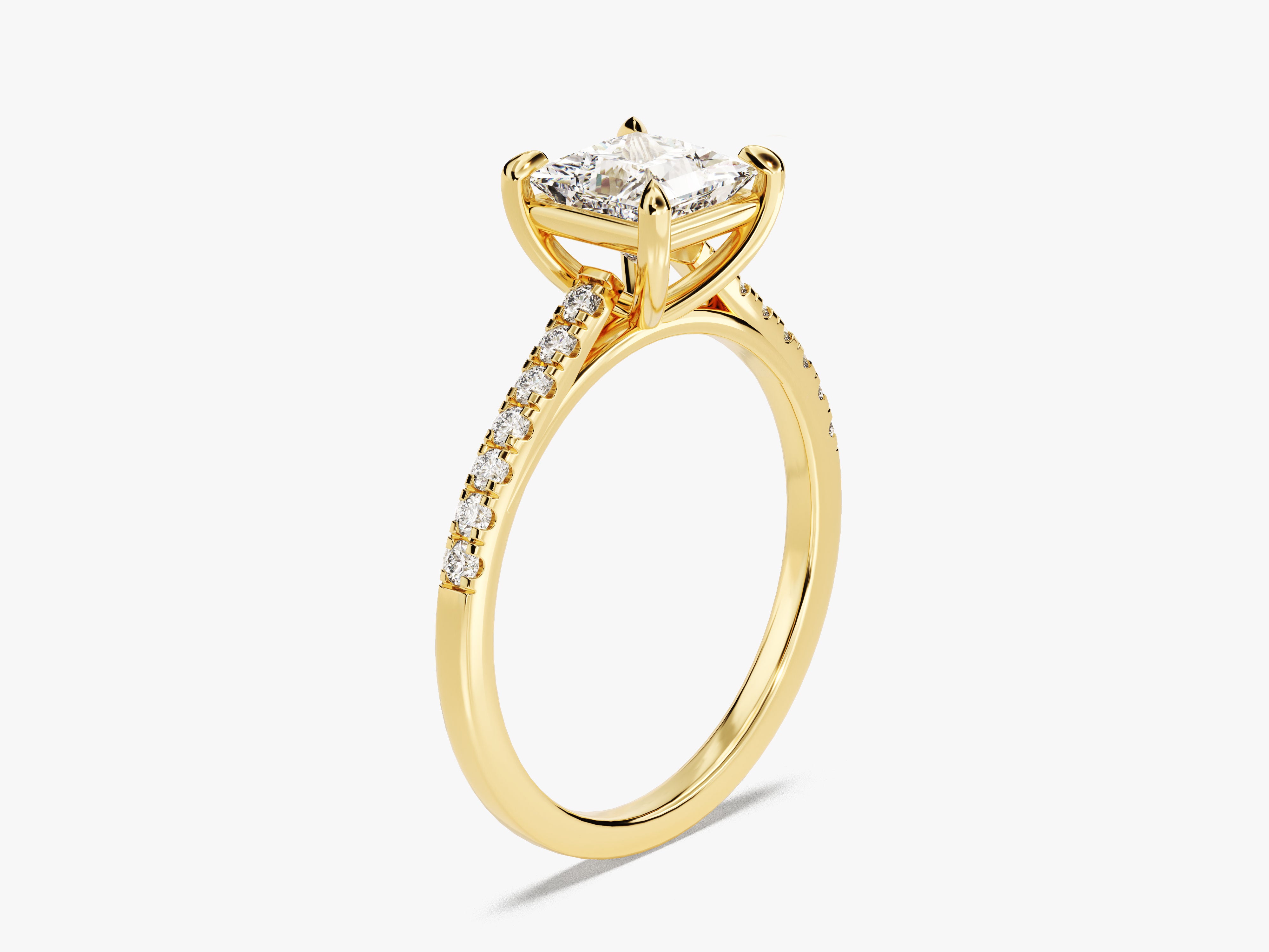 Gold engagement ring with princess cut diamond and pave band