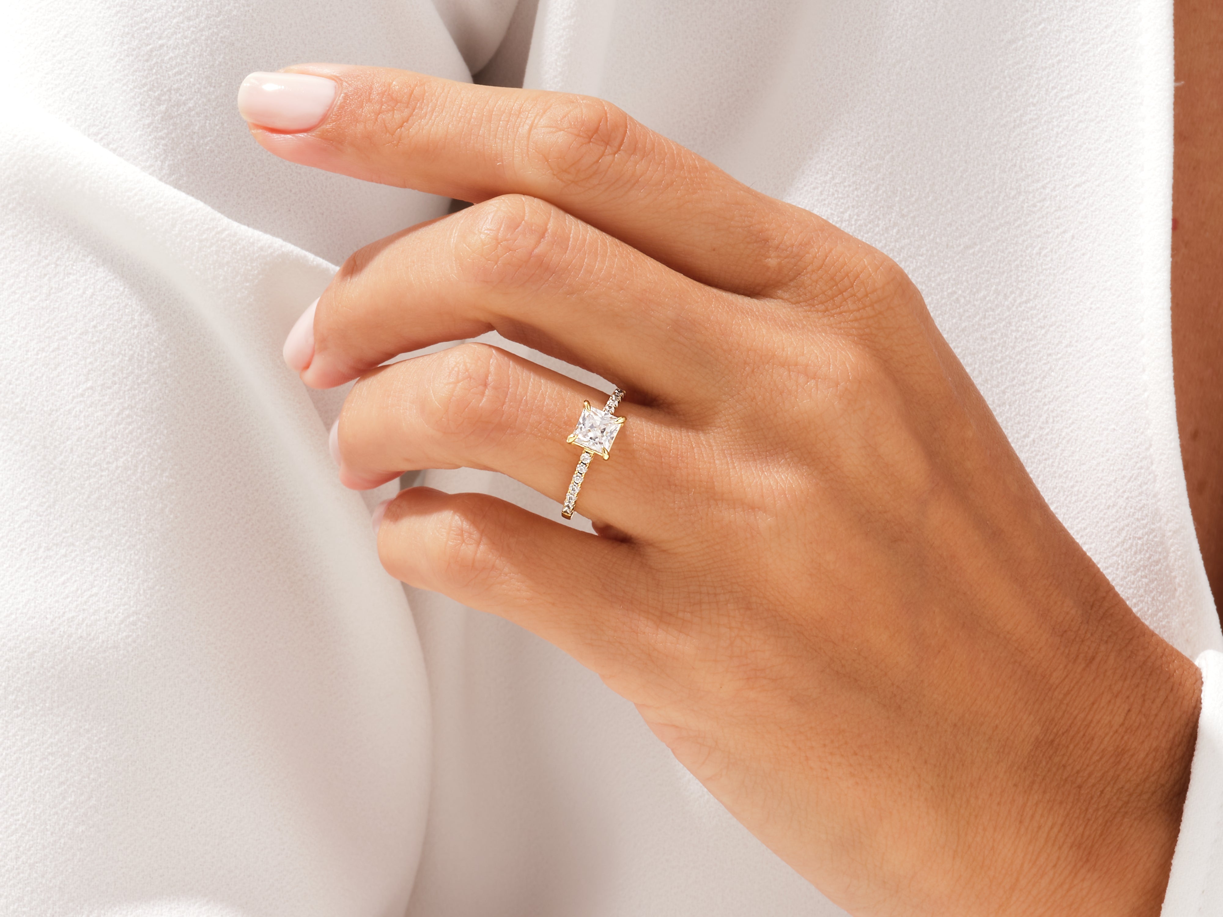 Diamond engagement ring on a woman's hand, jewelry photography