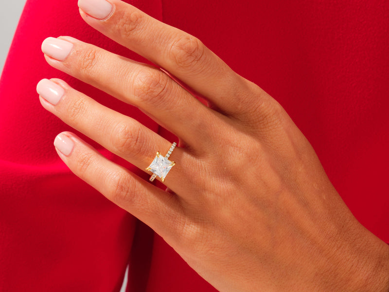 Diamond engagement ring on a hand, jewelry product photography