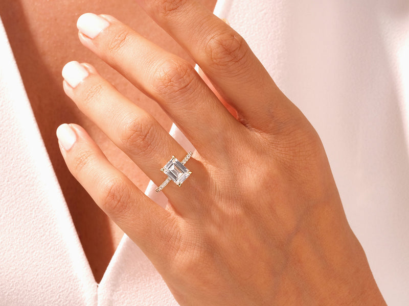 Emerald cut diamond ring on a woman's hand