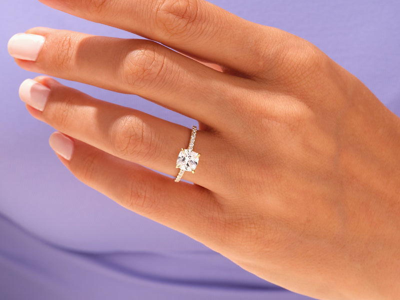 Diamond engagement ring on a hand, jewelry product