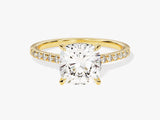 Gold diamond engagement ring with cushion-cut center stone