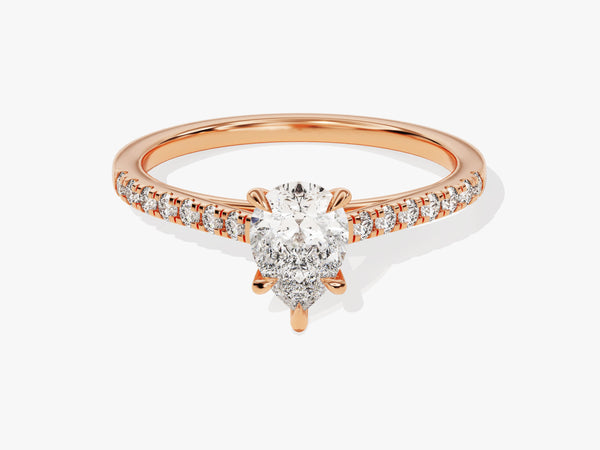 Rose gold pear cut diamond engagement ring with pavé band