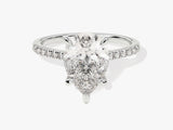 Pear cut diamond engagement ring with pavé band