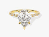 Gold pear cut diamond engagement ring with pave band