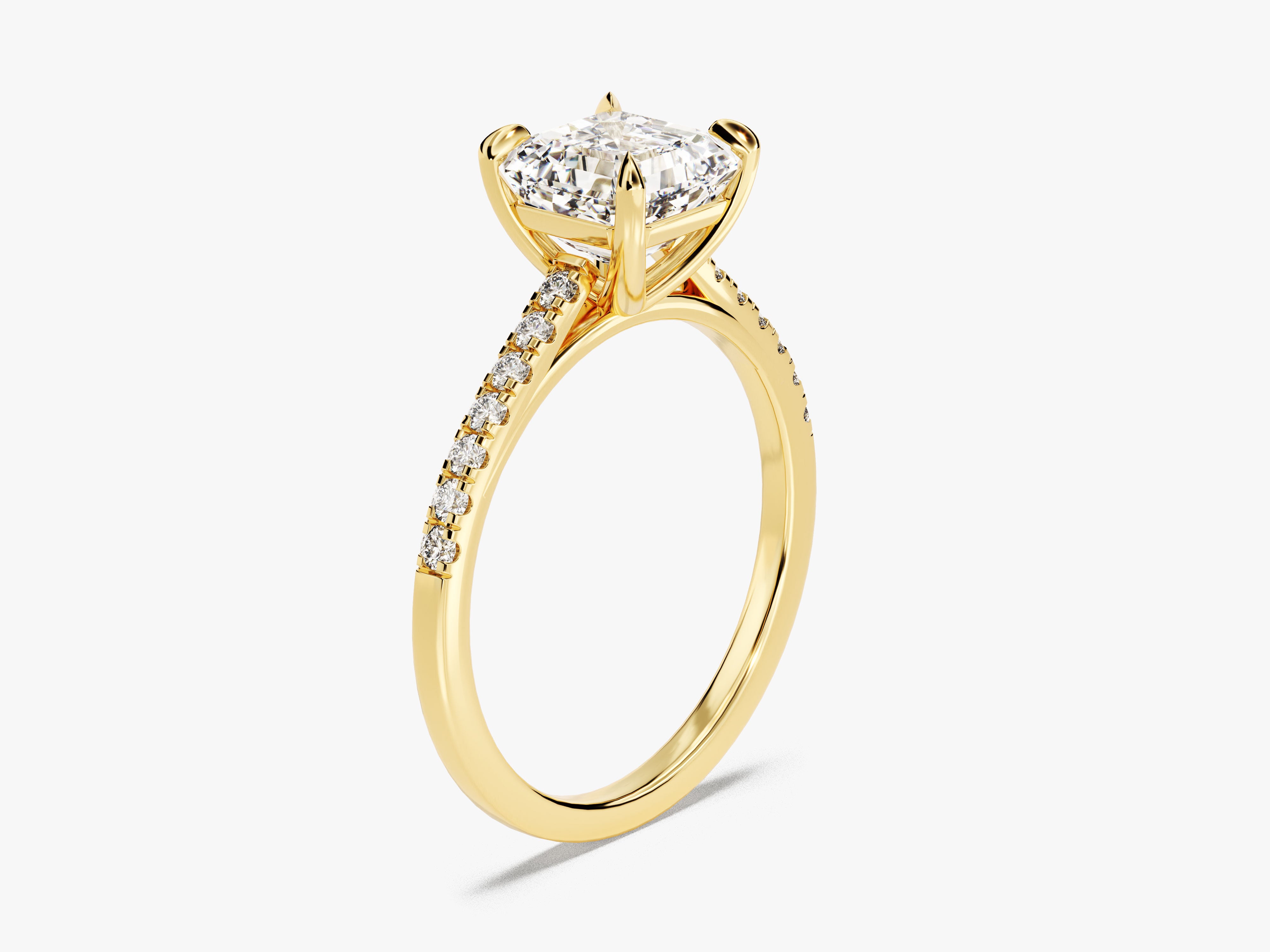 Gold diamond engagement ring with princess cut center stone