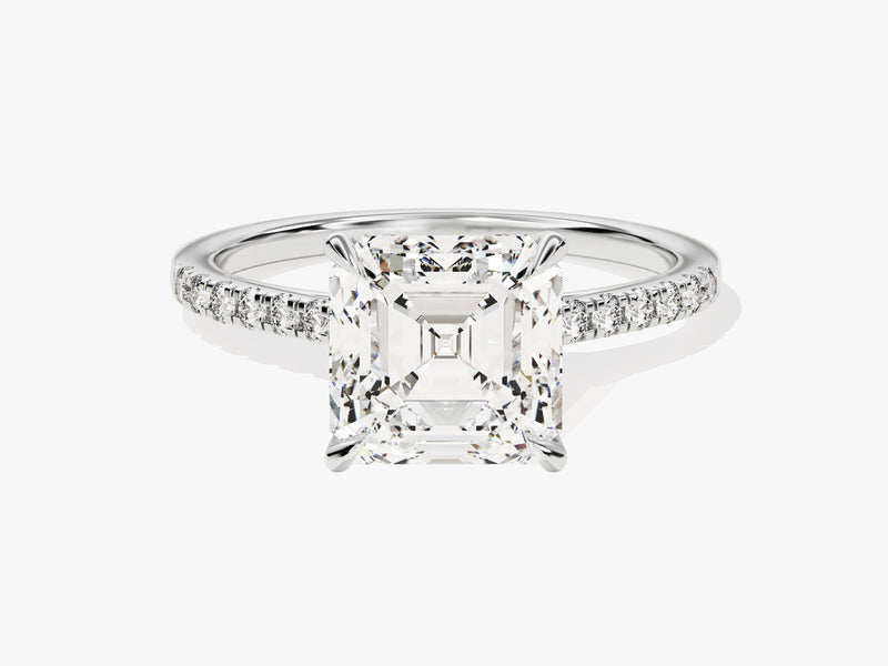 Emerald cut diamond engagement ring with pave band