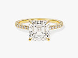 Emerald cut diamond ring with pave band in yellow gold