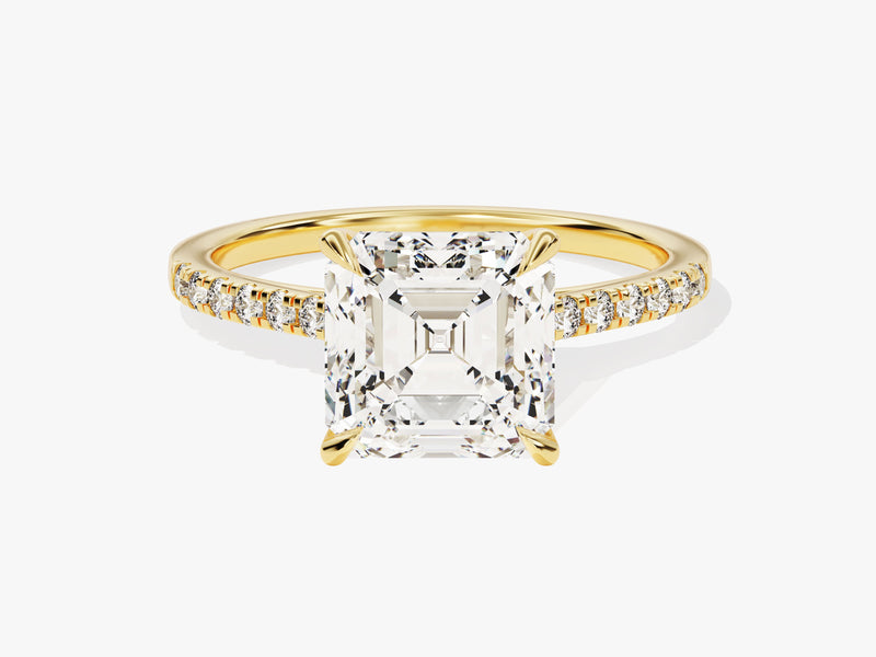 Emerald cut diamond ring with pave band in yellow gold
