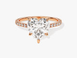 Heart-shaped diamond engagement ring in rose gold with pave diamonds