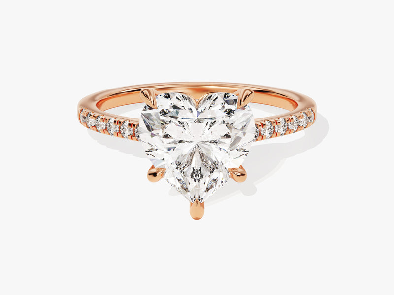 Heart-shaped diamond engagement ring in rose gold with pave diamonds