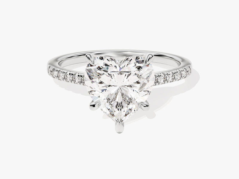 Heart-shaped diamond engagement ring with pave band
