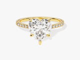 Gold ring with heart-shaped diamond and diamond band