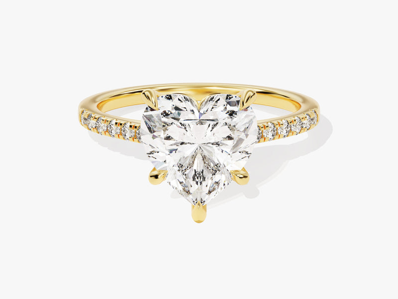 Gold ring with heart-shaped diamond and diamond band
