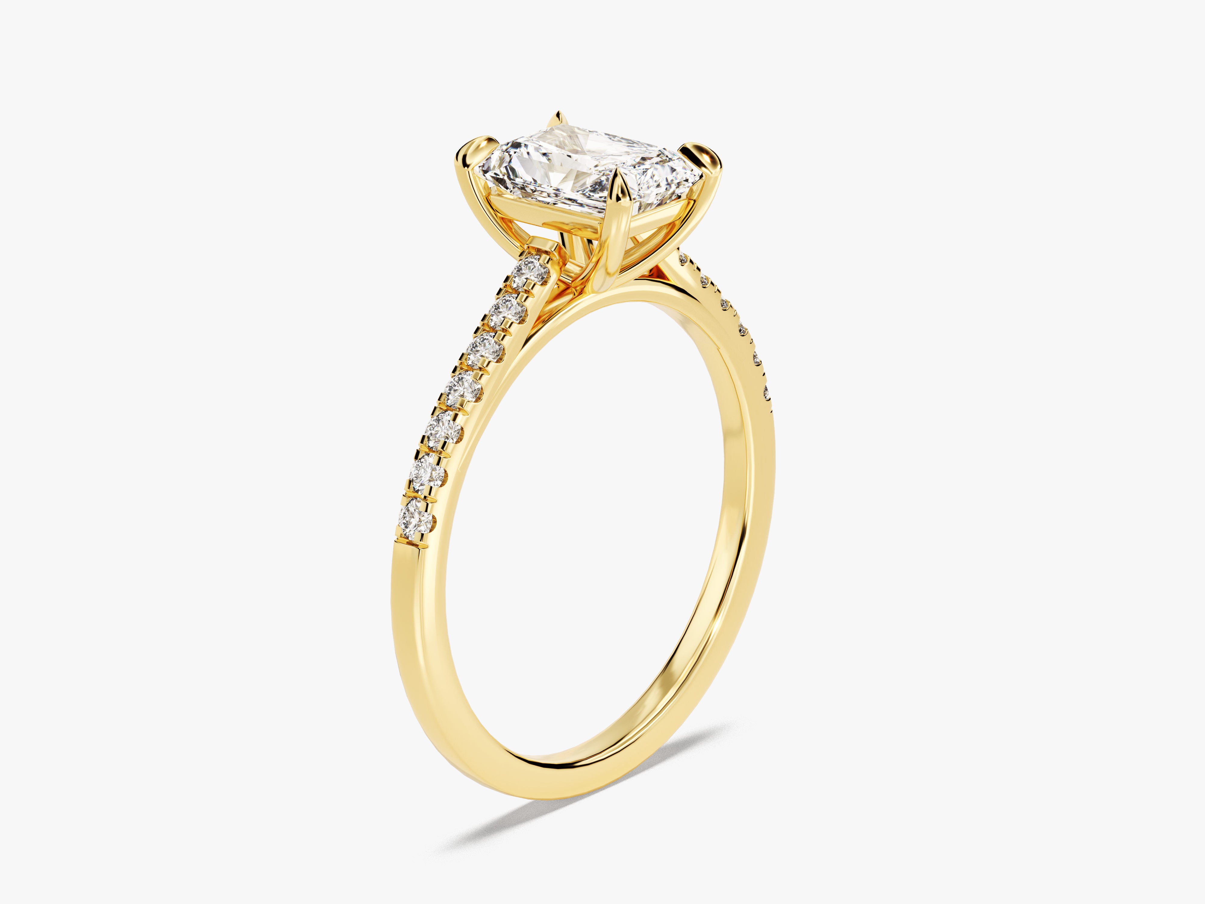 Gold diamond engagement ring with cushion cut center stone