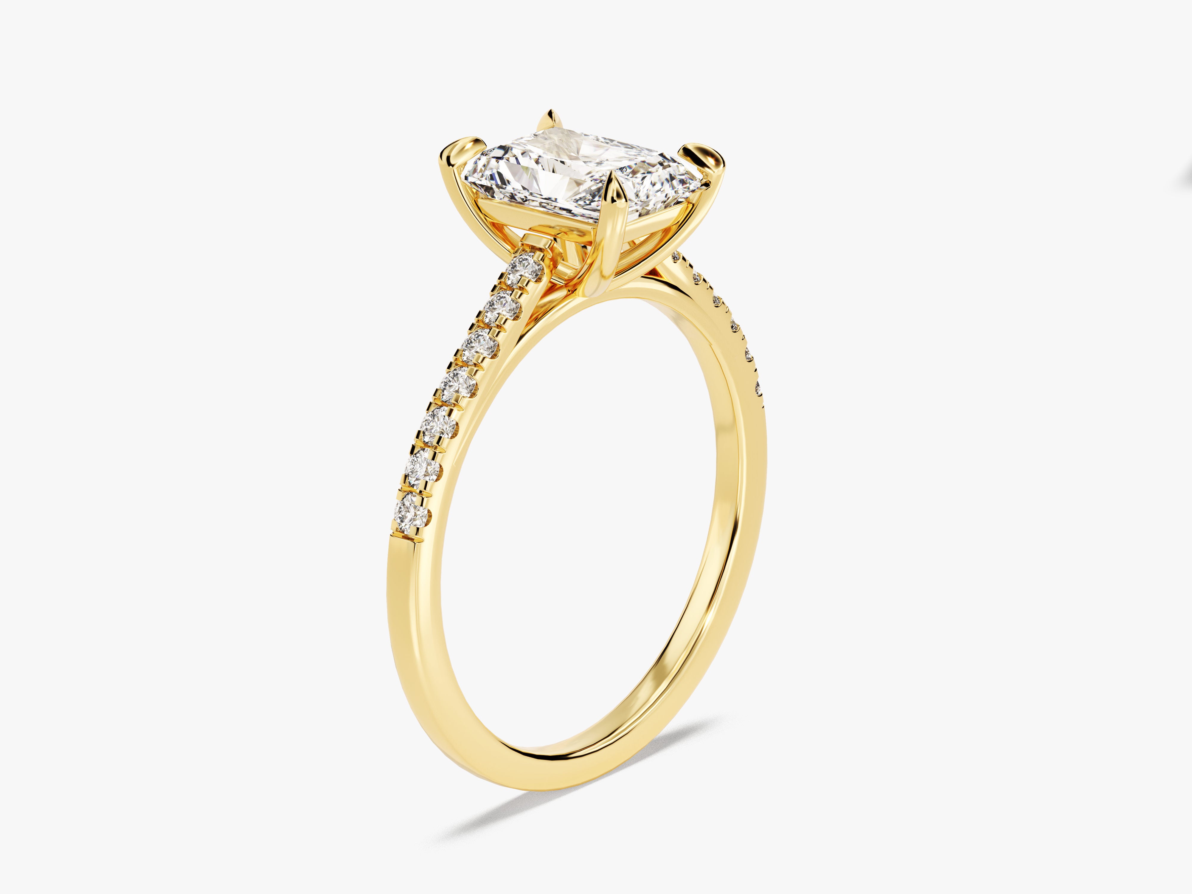 Gold diamond engagement ring with radiant cut center stone