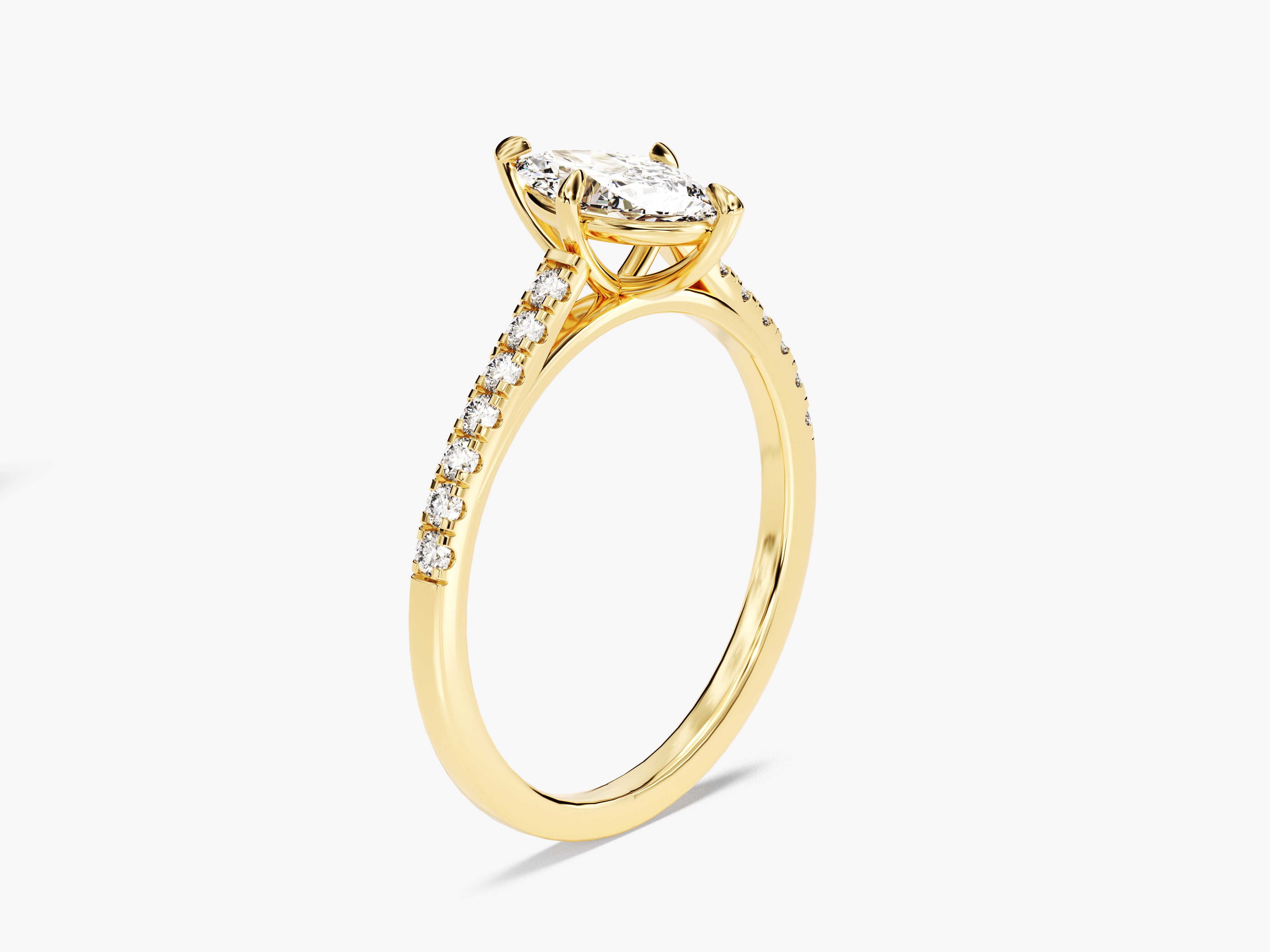 Gold diamond engagement ring with marquise cut center stone