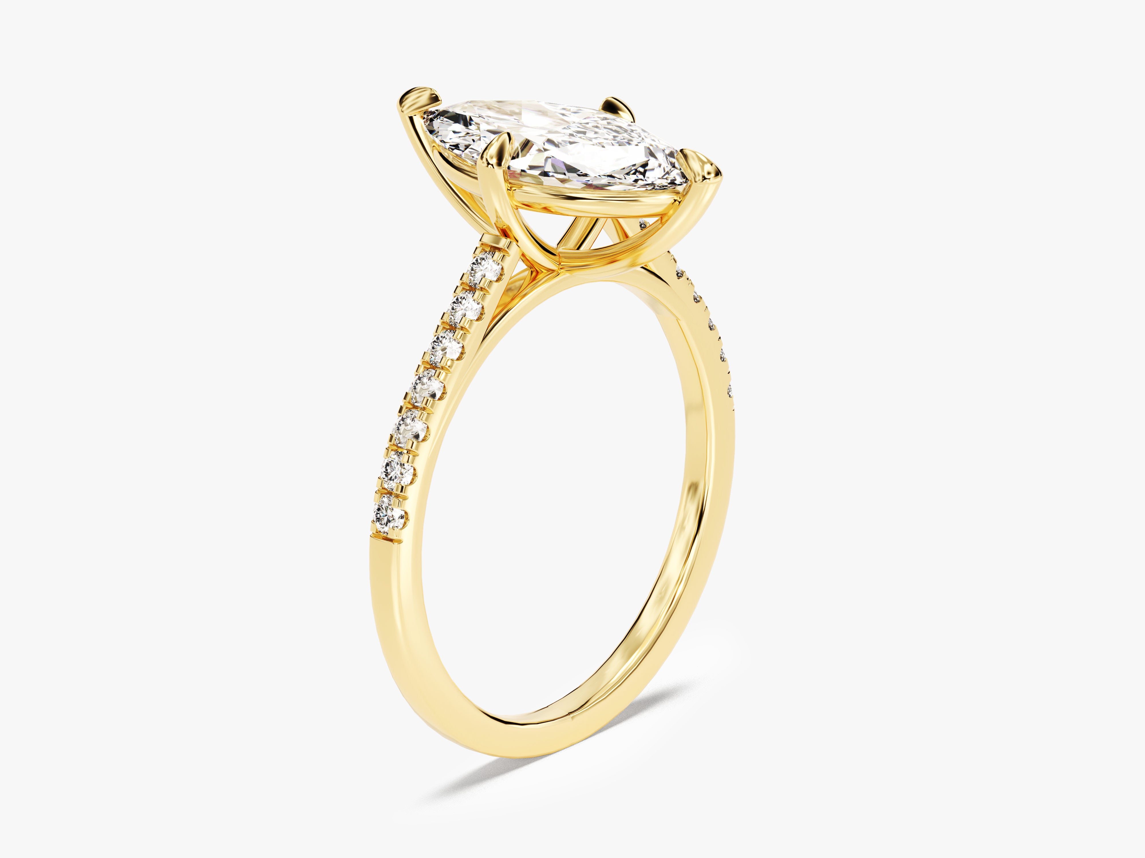 Marquise diamond engagement ring in yellow gold with pave band