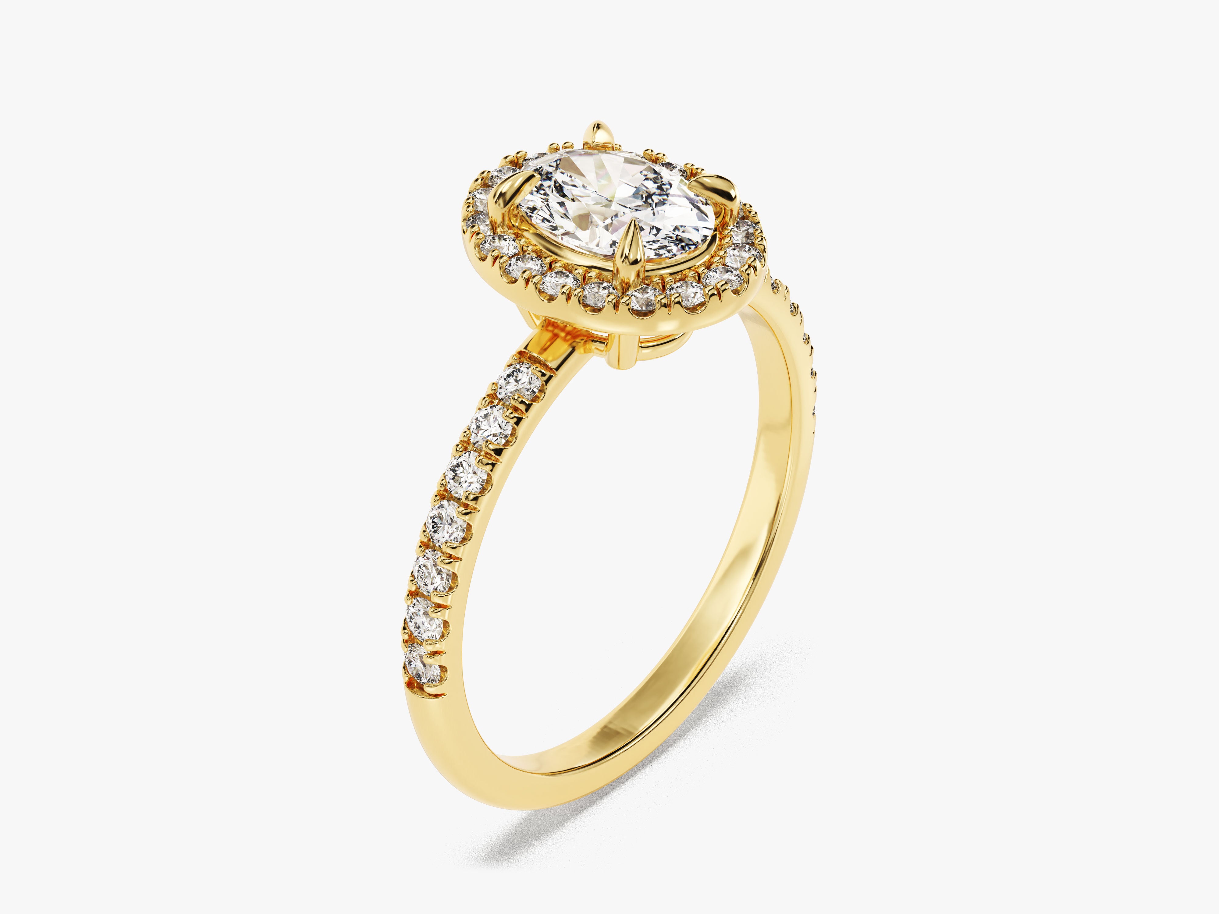 Gold diamond halo ring with oval center stone