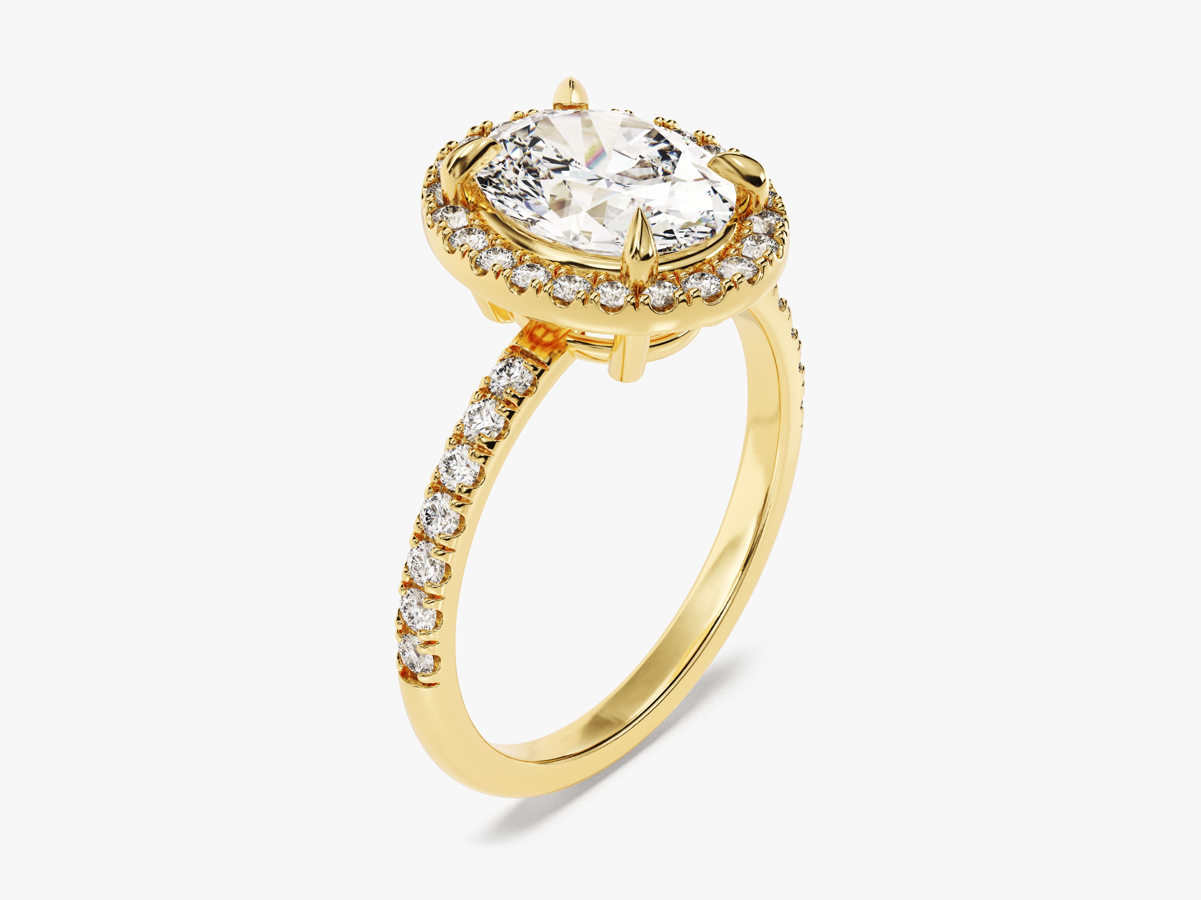Gold diamond halo ring with oval center stone