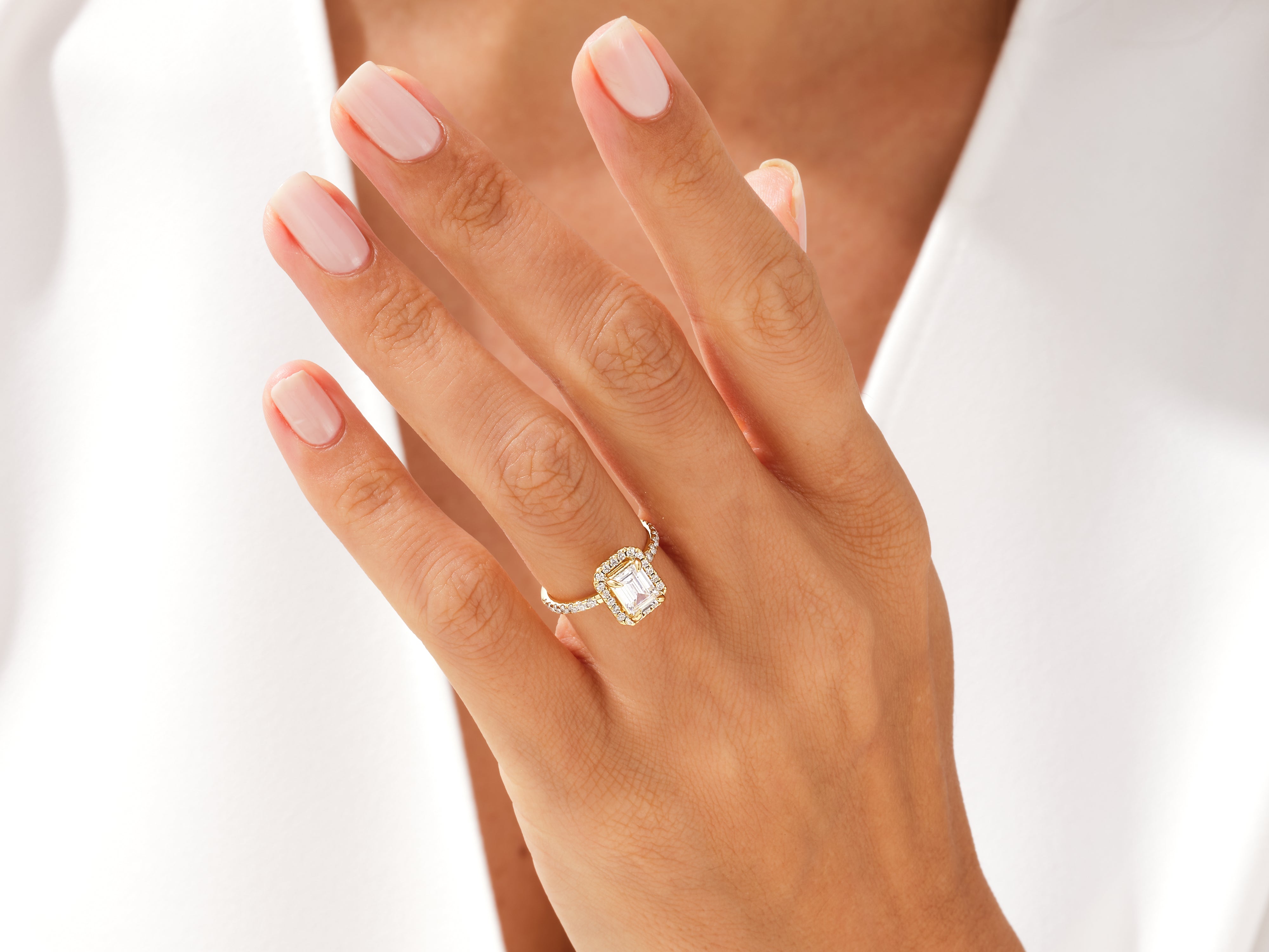 Diamond engagement ring on a woman's hand, jewelry firm product