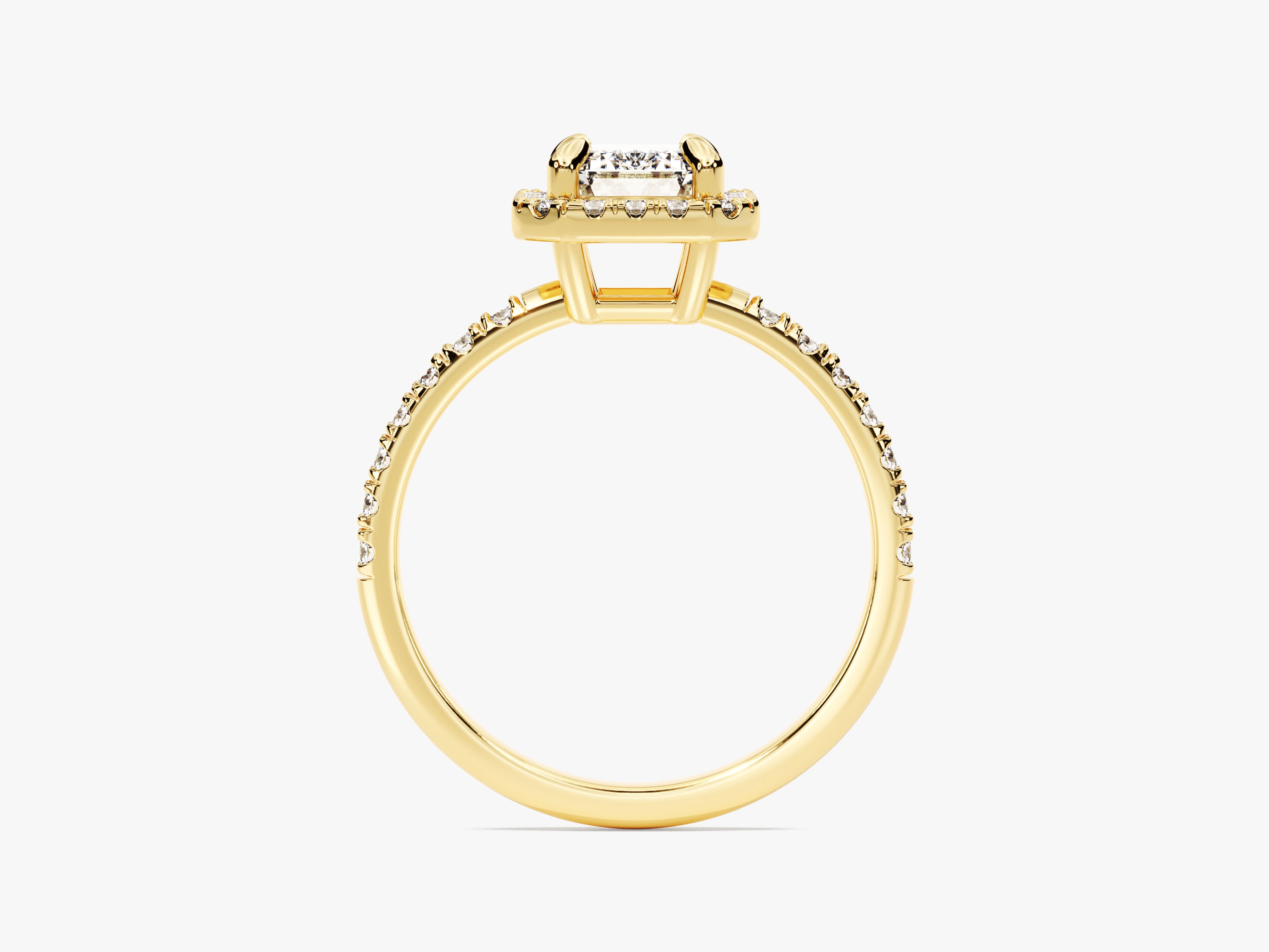 Gold ring with emerald cut diamond and pave band