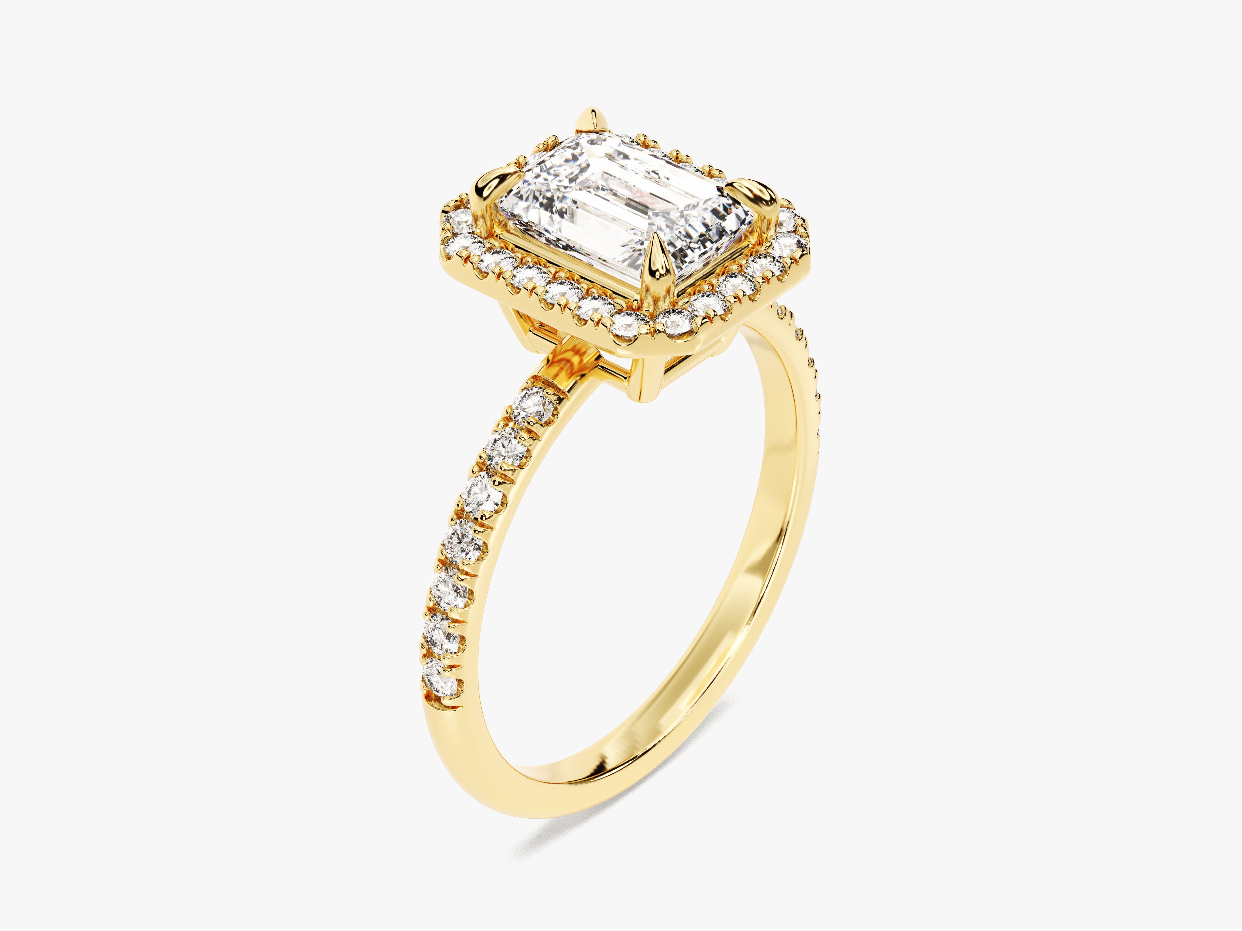 Emerald cut diamond halo ring in yellow gold