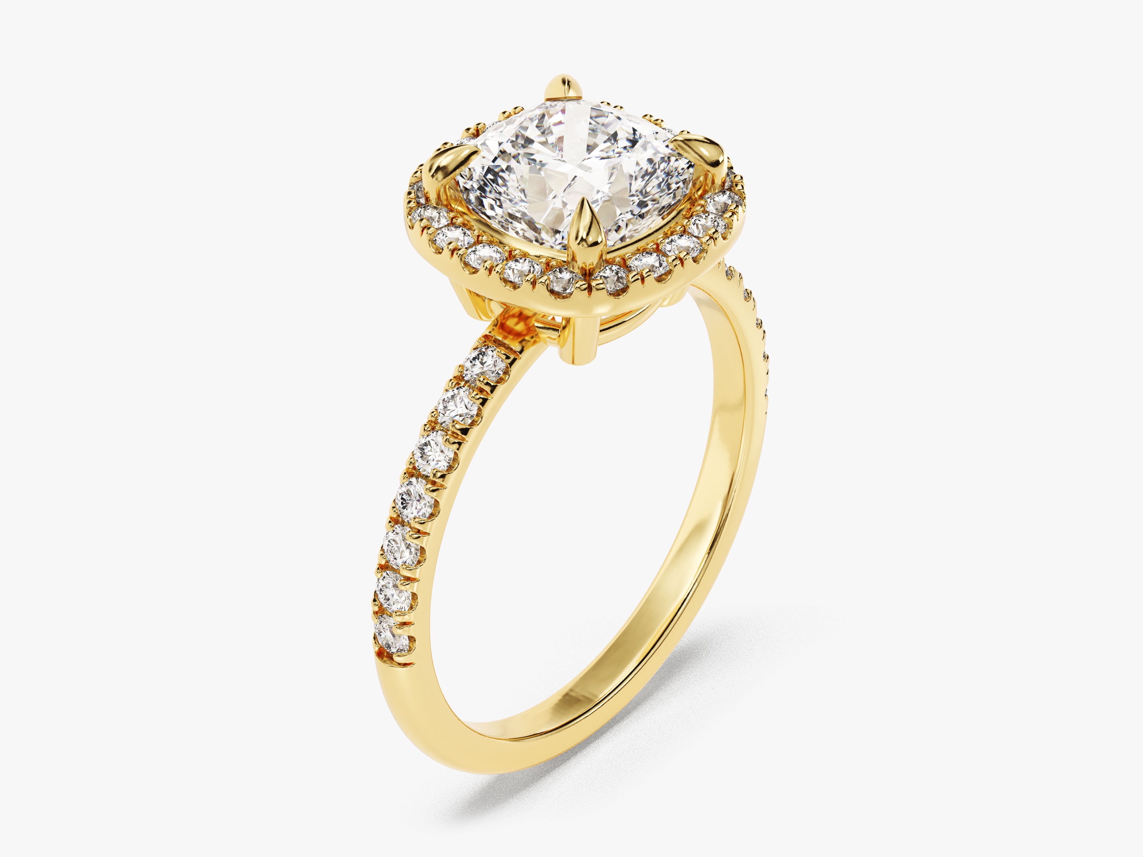 Gold diamond halo engagement ring with cushion cut center stone