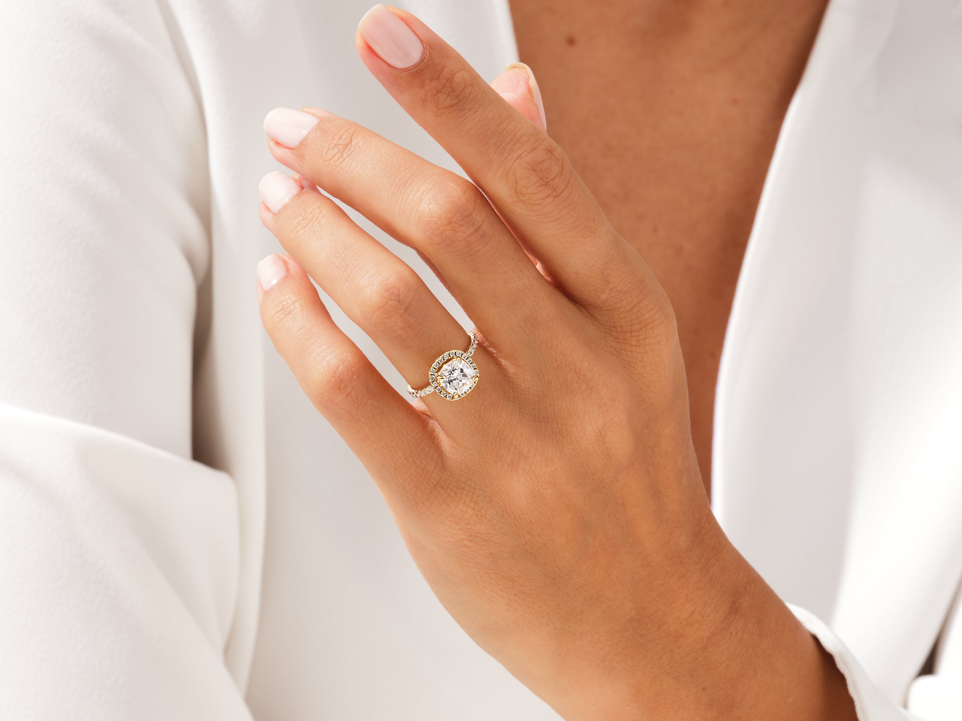 Diamond engagement ring on a woman's hand, jewelry photography