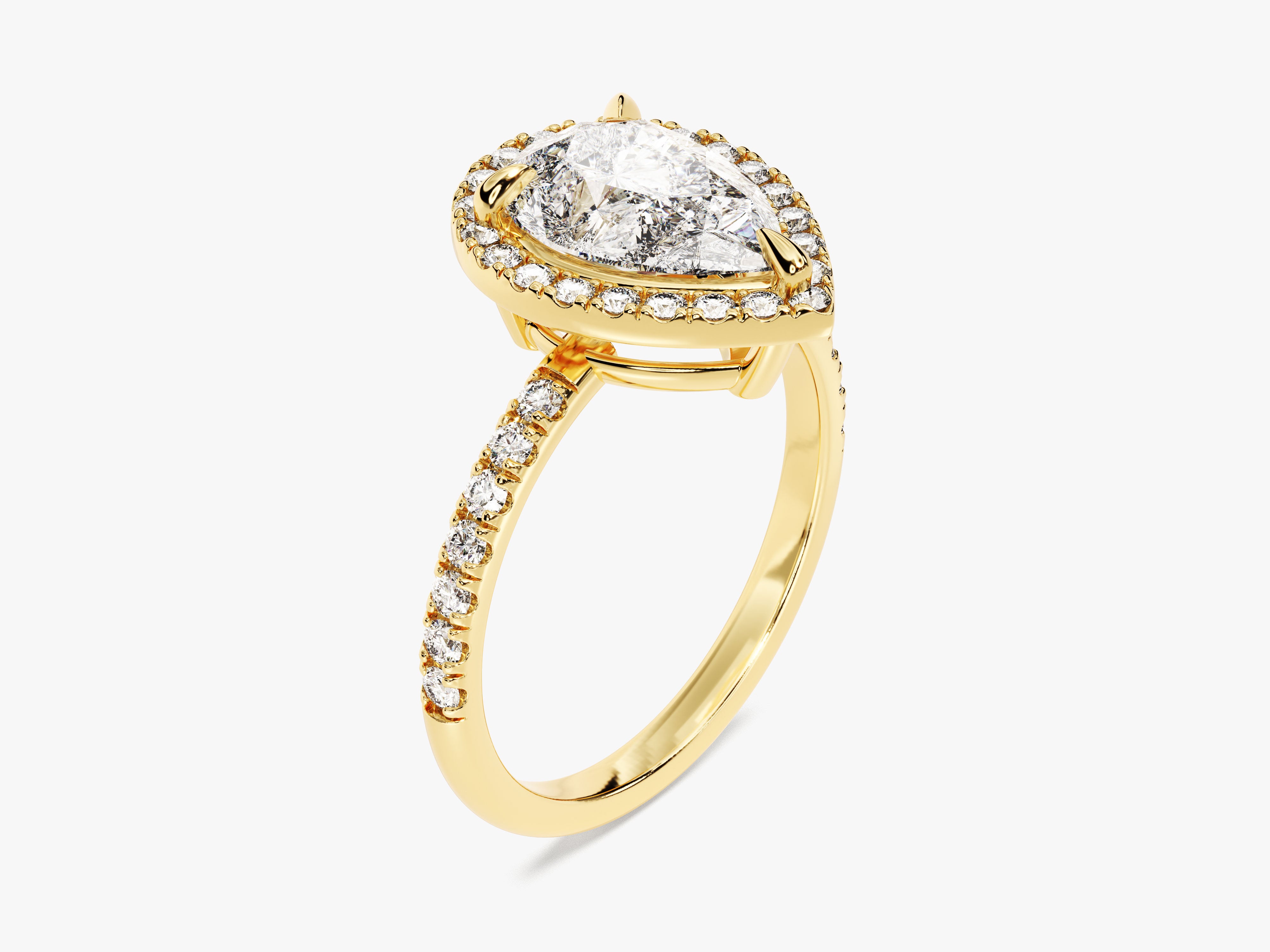 Pear diamond halo engagement ring in yellow gold