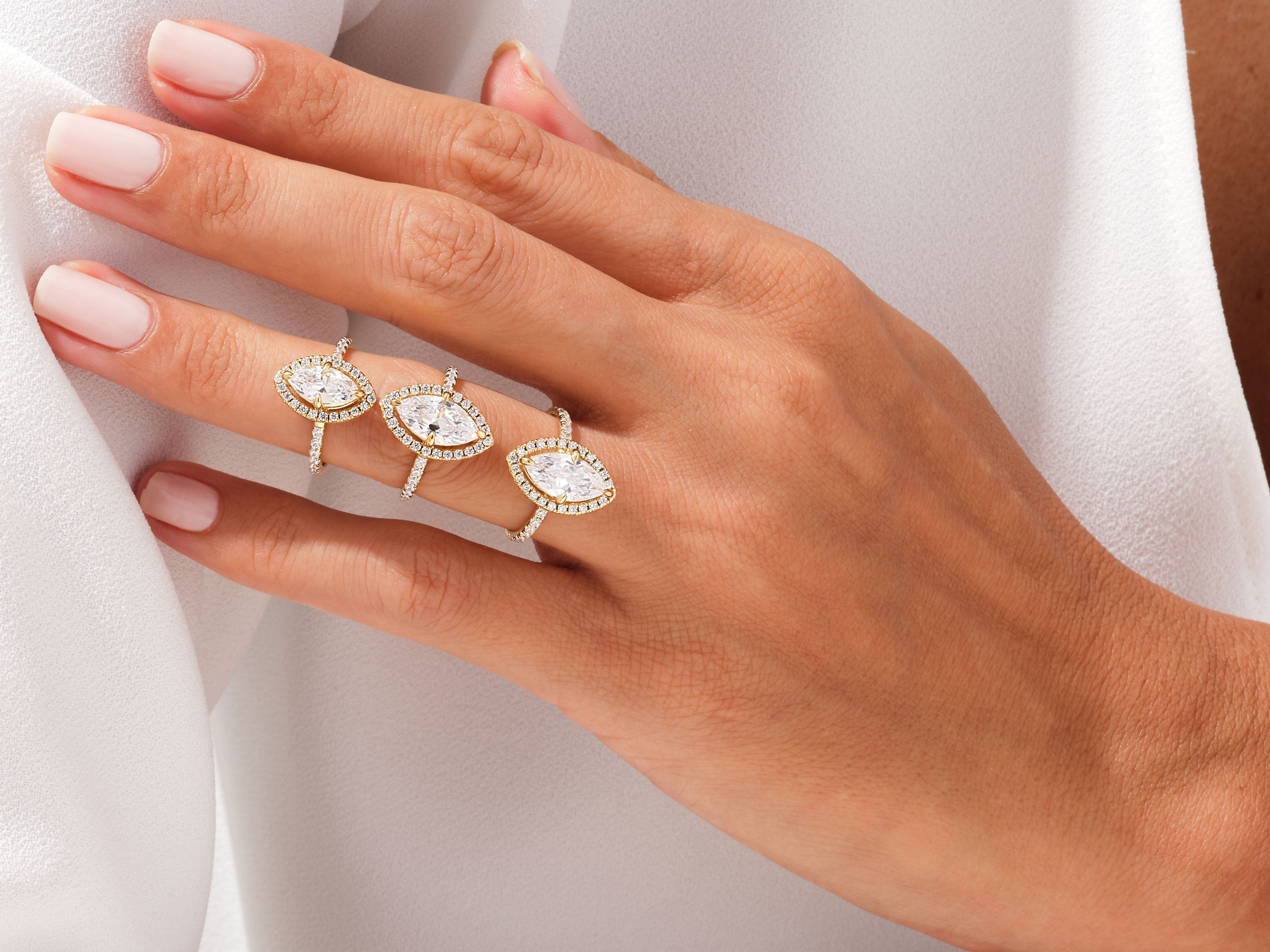 Diamond marquise rings on hand, luxury jewelry for women