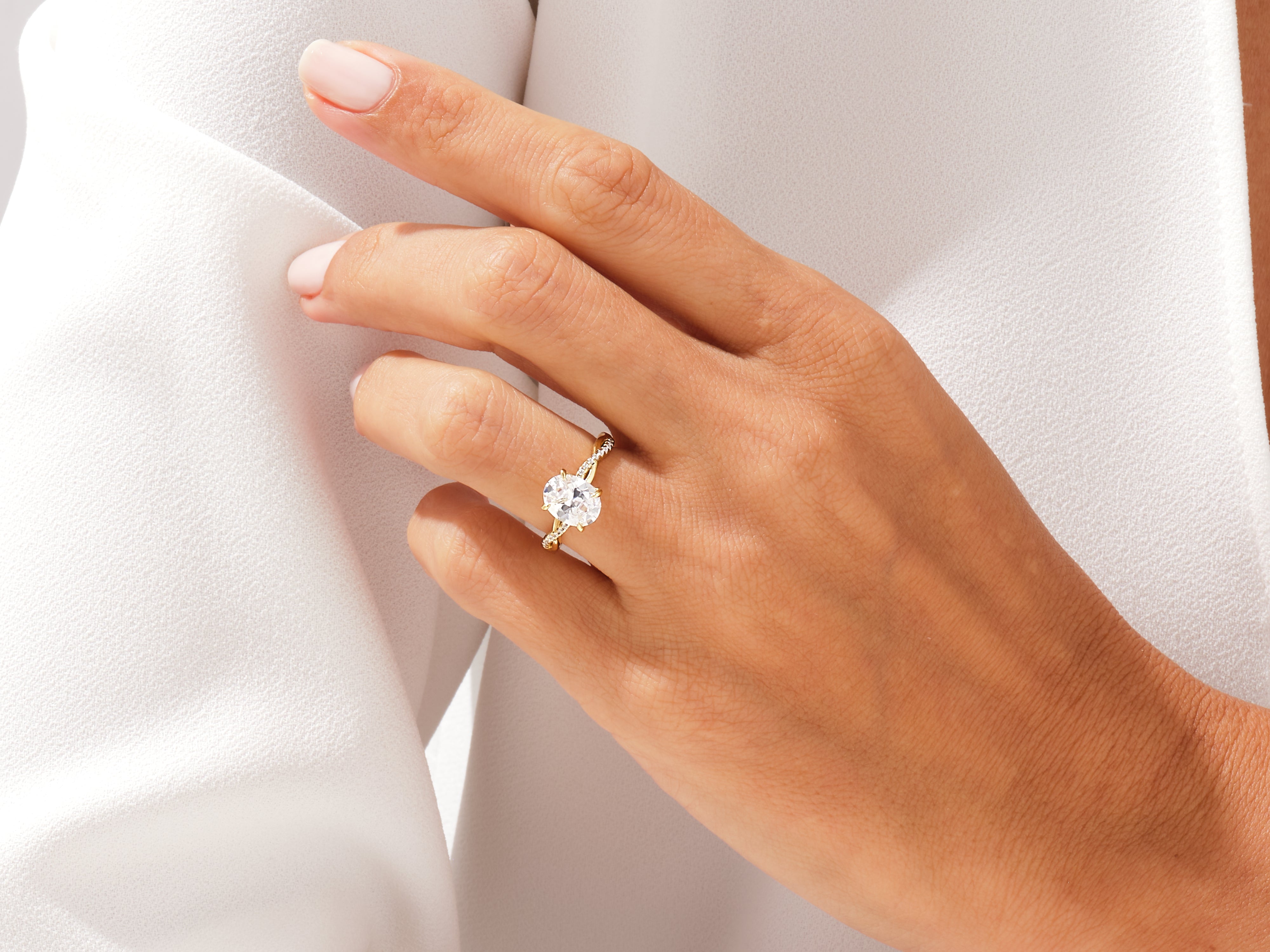 Oval diamond engagement ring on a woman's hand