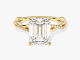 Emerald cut diamond ring with twisted gold band and pave diamonds