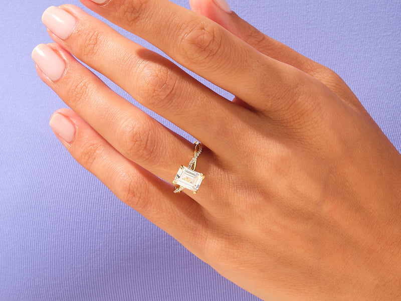 Emerald cut diamond ring on a hand, fine jewelry