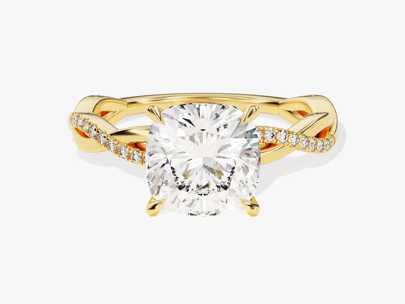 Gold diamond engagement ring with cushion cut center stone