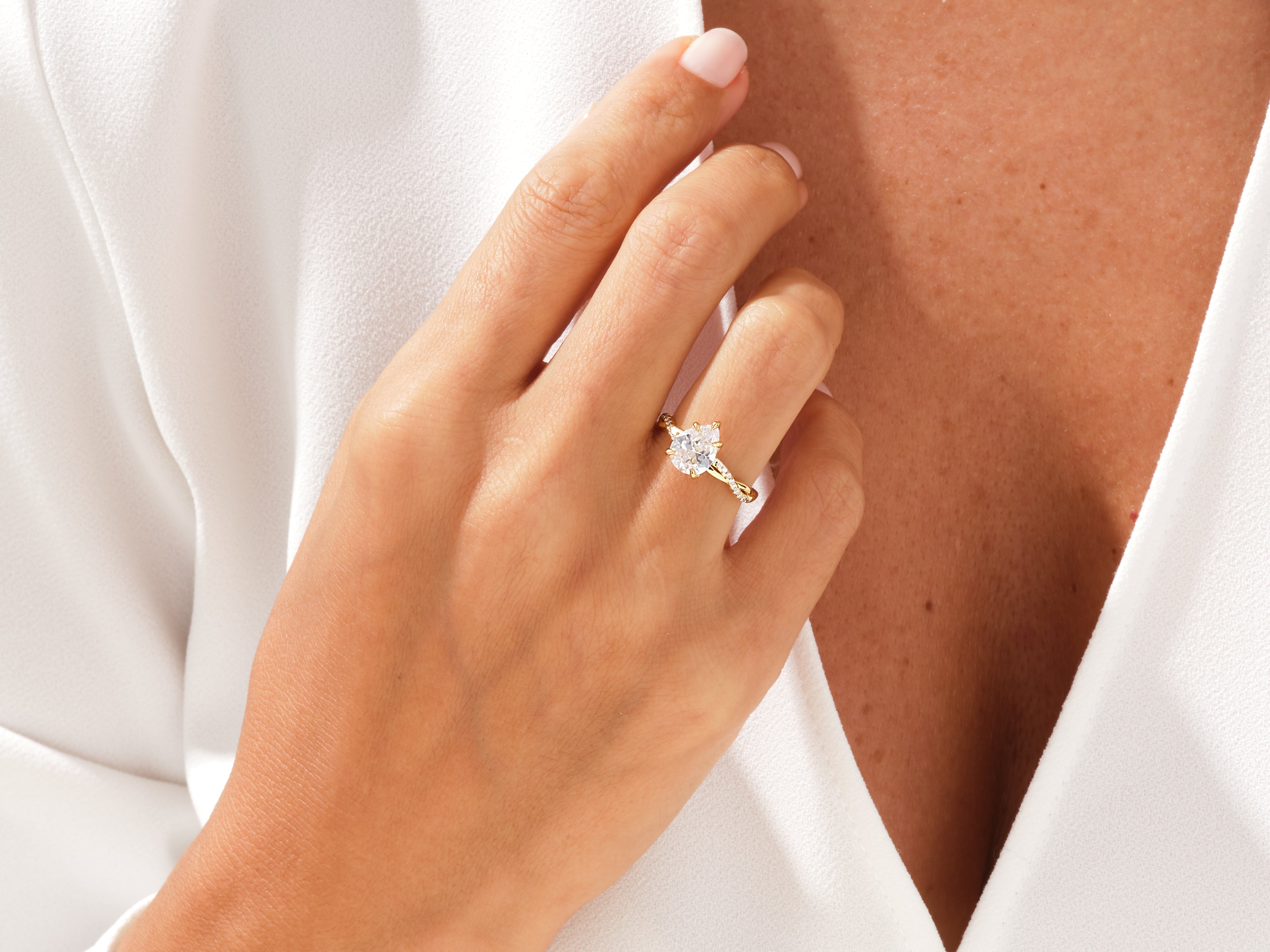 Diamond engagement ring on a woman's hand, fine jewelry