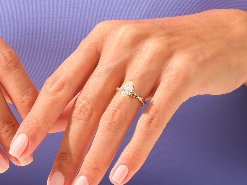 Pear Twisted Moissanite Engagement Ring with Pave Set Side Stones (3.00 CT)
