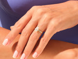 Pear-shaped diamond engagement ring on a woman's hand