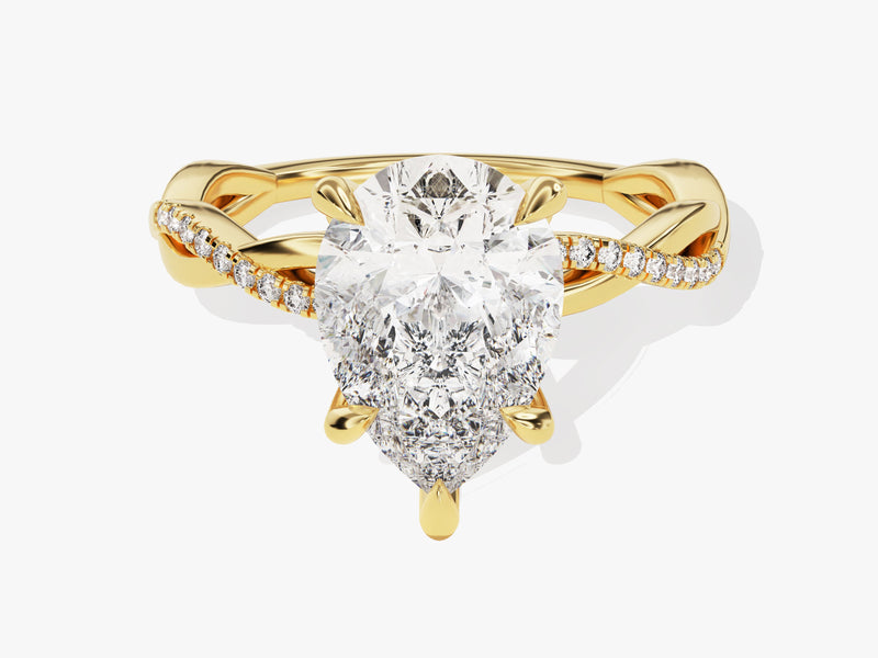 Gold pear cut diamond engagement ring with pavé band