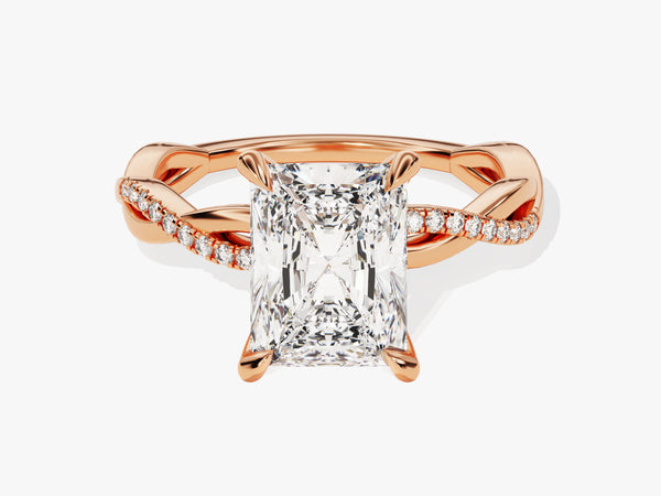Rose gold twisted band ring with radiant cut diamond and pavé diamonds