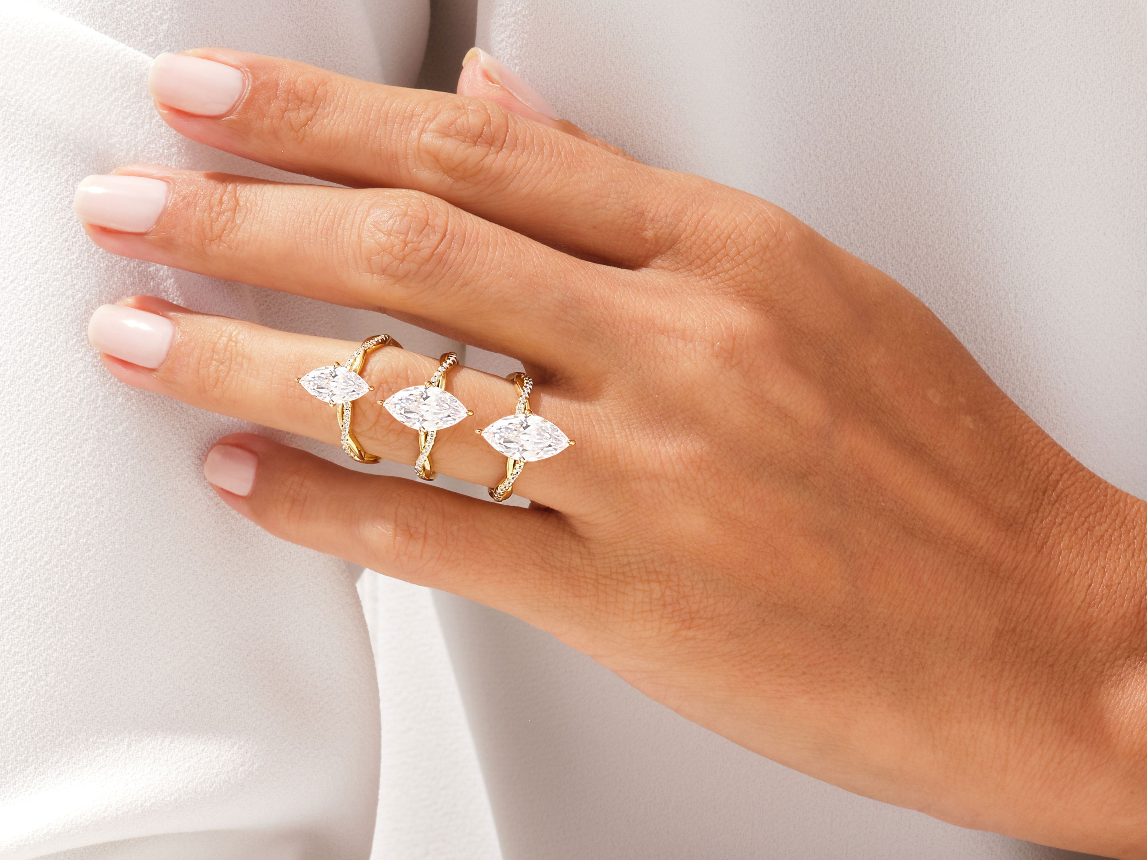 Marquise diamond rings on hand, luxury jewelry collection