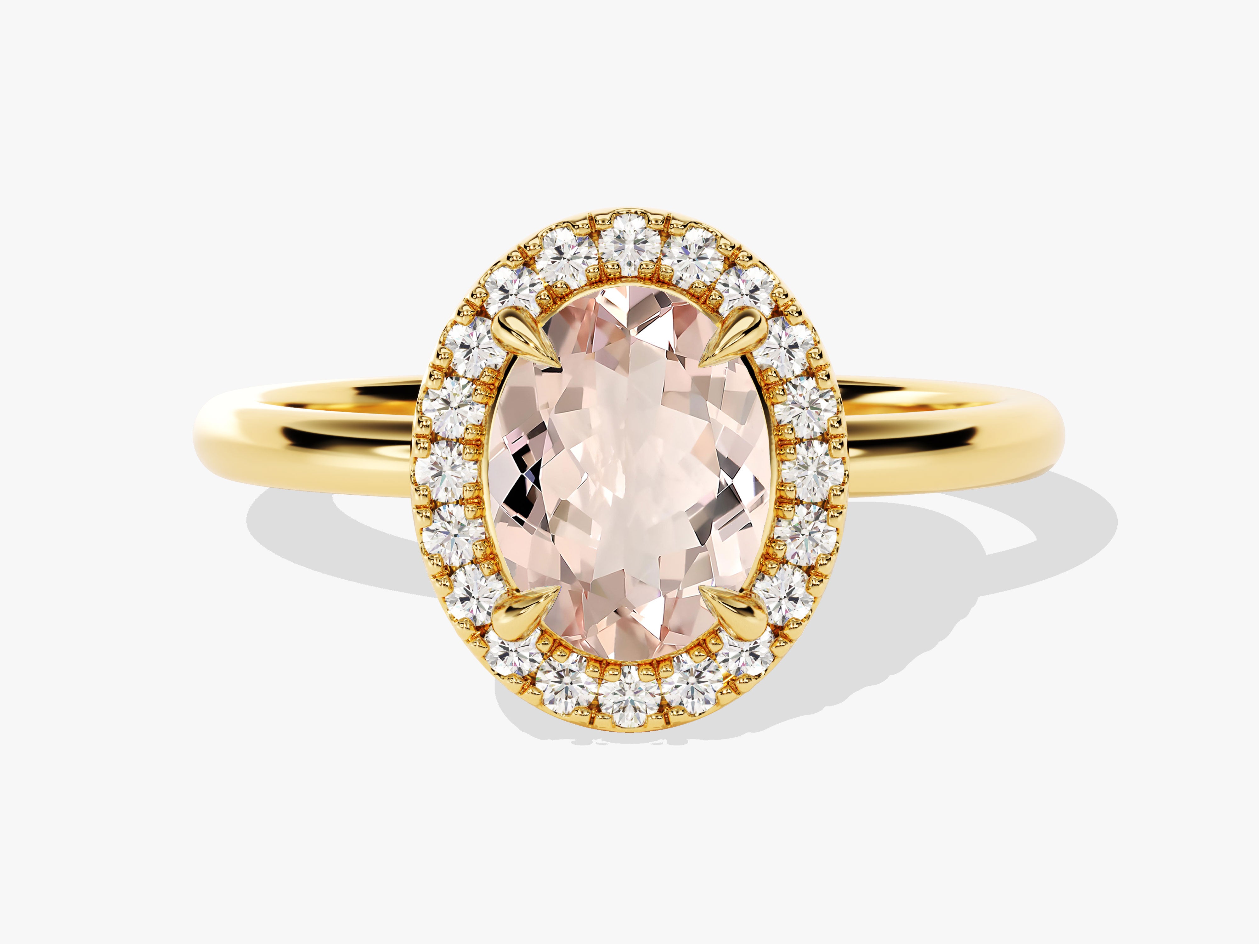 Oval morganite and diamond halo engagement ring in gold