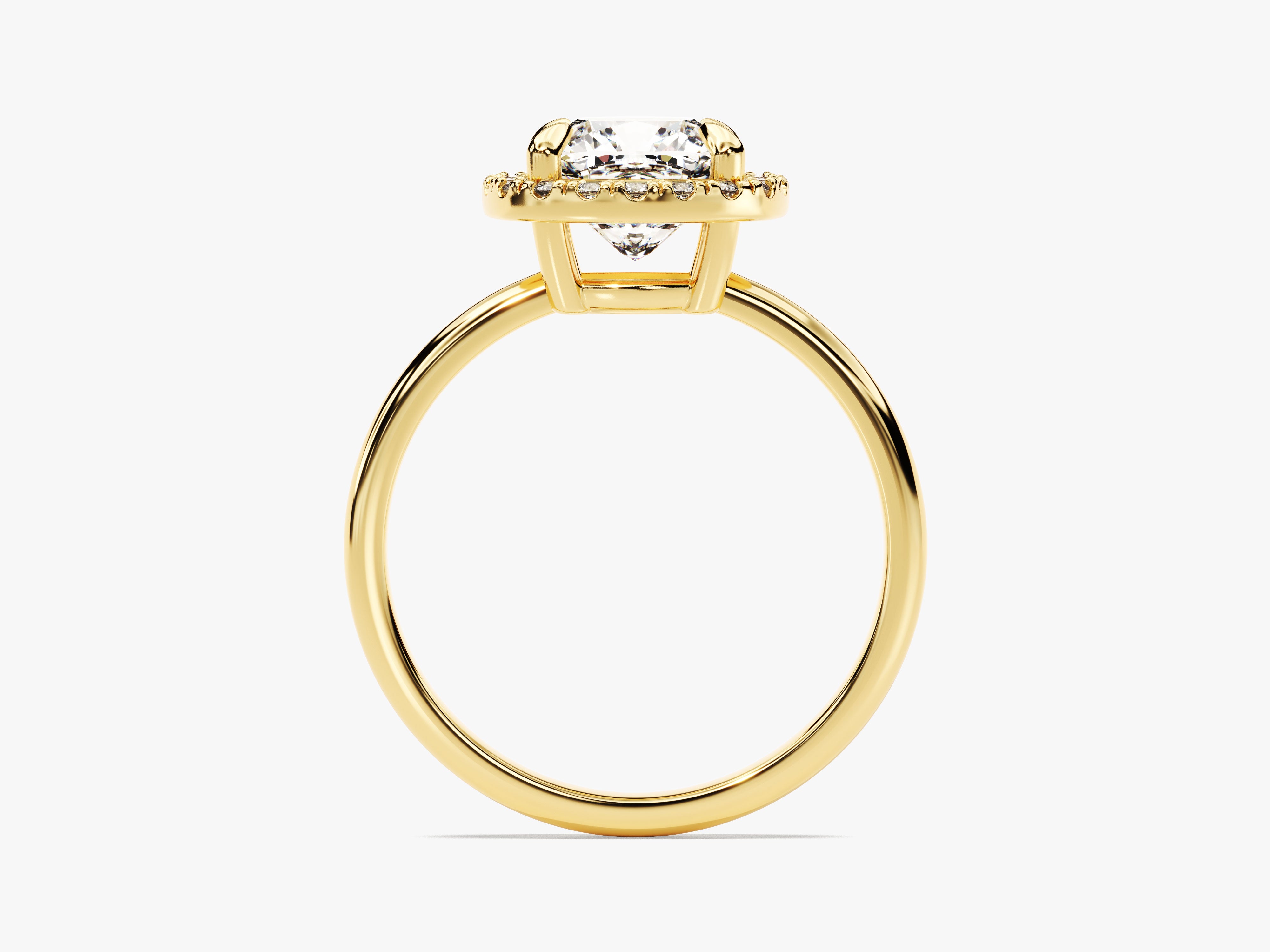 Gold halo engagement ring with a cushion-cut diamond